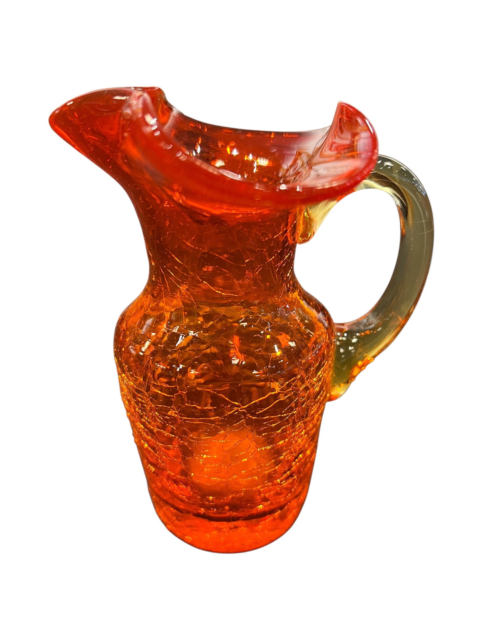 vintage Blenko Amberina crackle glass pitcher: This is a vintage Blenko Amberina crackle glass pitcher featuring a vibrant orange and red gradient. [1, 2]Design Details: The pitcher has a distinctive crackled texture, created by dipping the hot gl