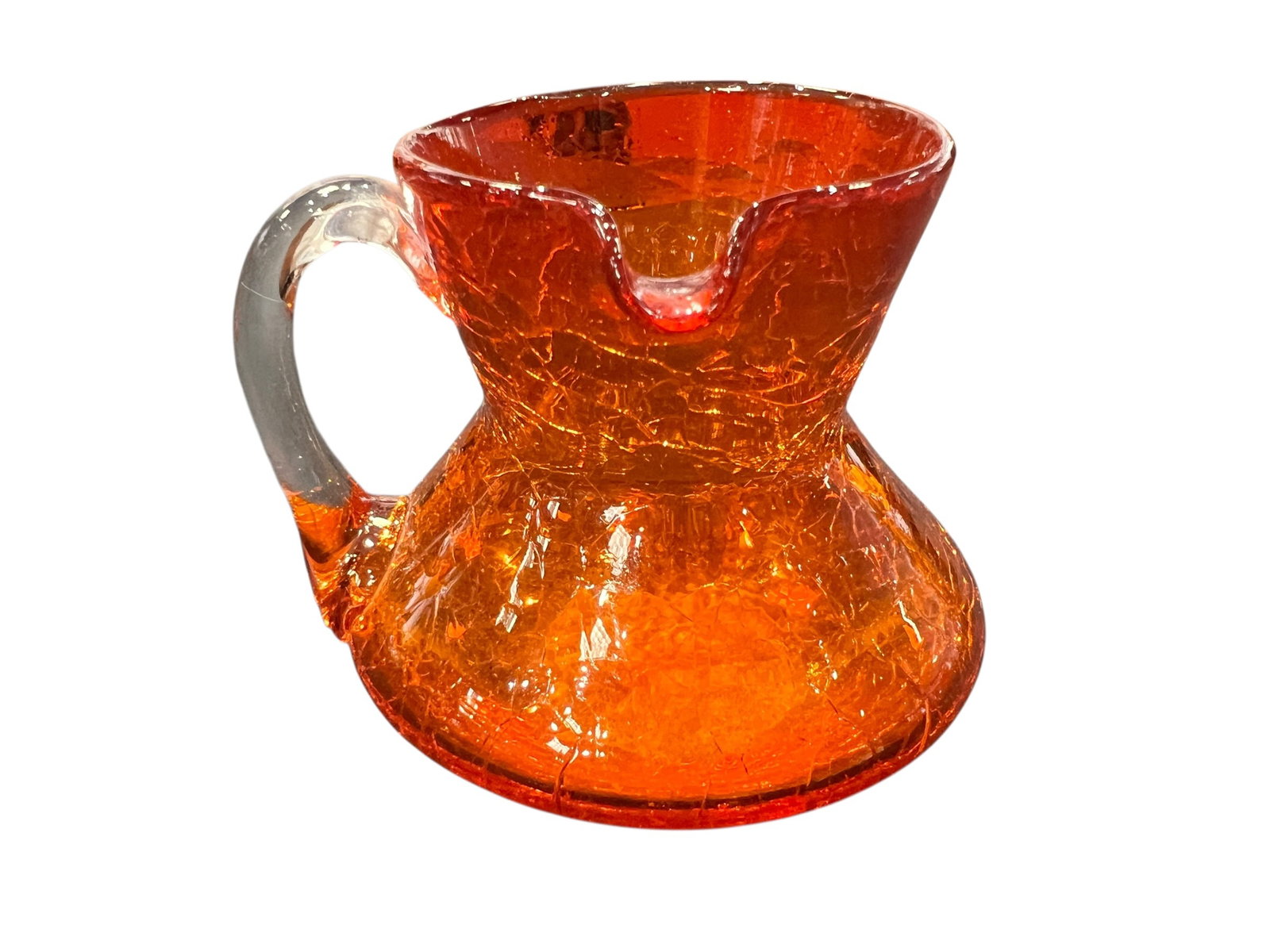 vintage Pilgrim Glass Company amberina orange crackle glass pitcher: This is a vintage Pilgrim Glass Company amberina orange crackle glass pitcher featuring an applied clear glass handle.Manufacturing Technique: The "crackle" effect was achieved by dipping hot glass in