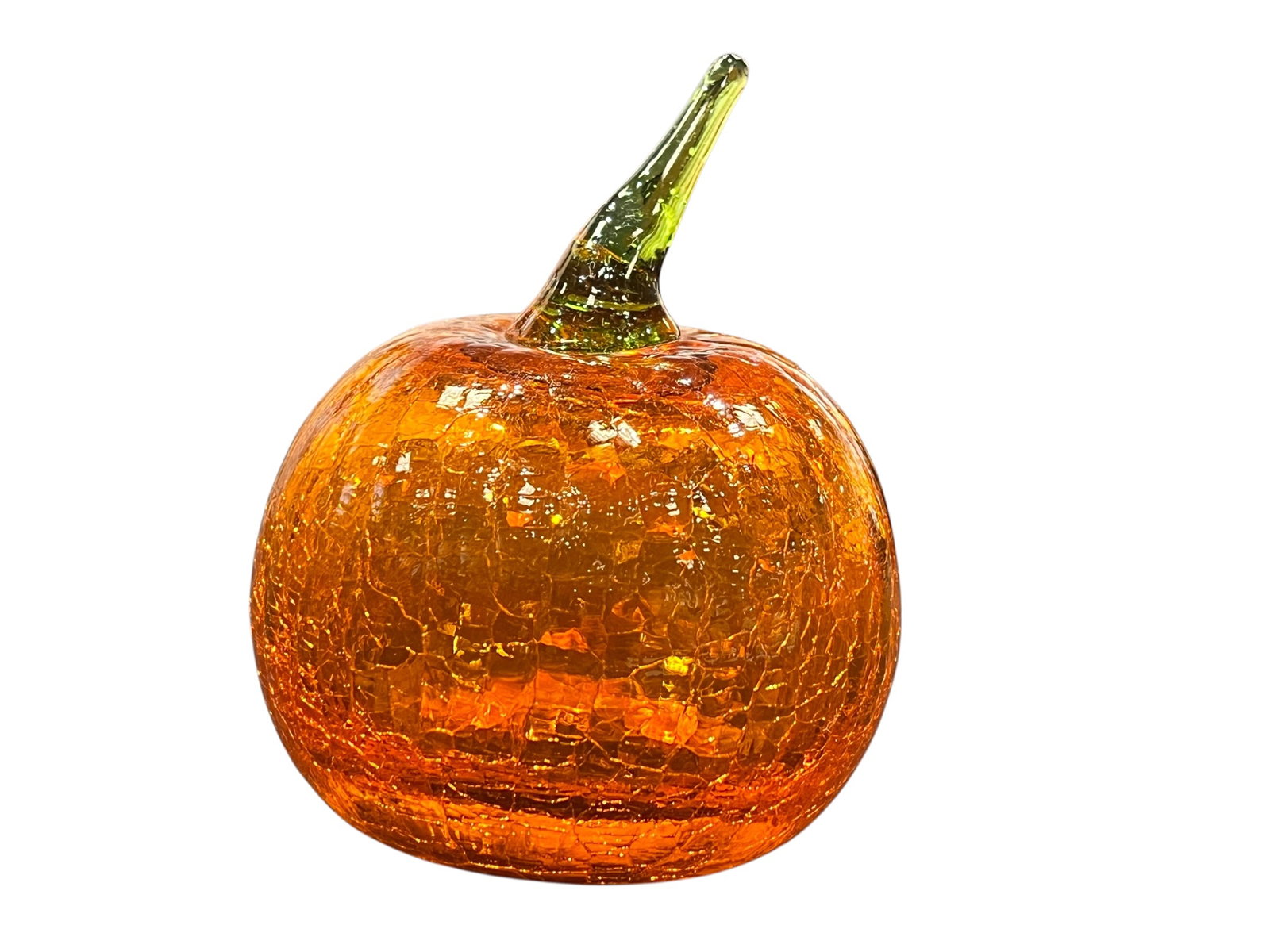 amber crackle finish glass pumpkin figurine with a green stem.: This is an amber crackle finish glass pumpkin figurine with a green stem.This decorative item features a hand-blown glass construction with a crackled texture for a shimmering effect.It often serves a