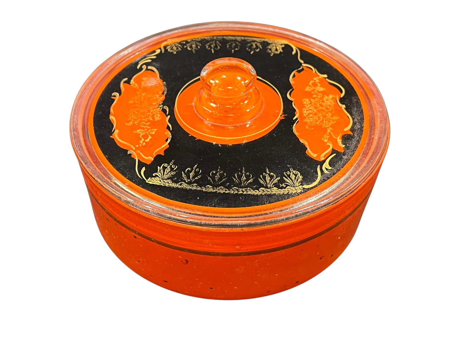 vintage orange glass jar: This item is a vintage Art Deco orange flash glass covered candy dish/powder jar. Manufactured in Czechoslovakia during the 1920s to 1930s, these distinctive items featured hand-painted enamel
