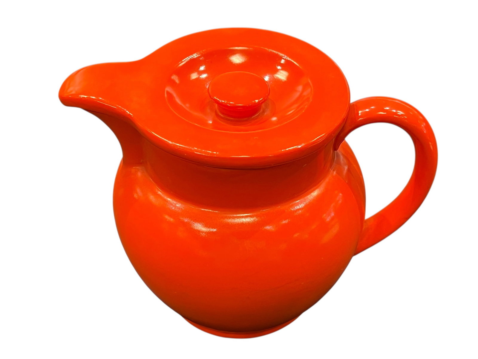 vintage Fiesta Kitchen Kraft Covered Jug: This vibrant ceramic piece is a vintage Fiesta Kitchen Kraft Covered Jug in original red (often called radioactive red or flame orange) produced by the Homer Laughlin China Company starting in the