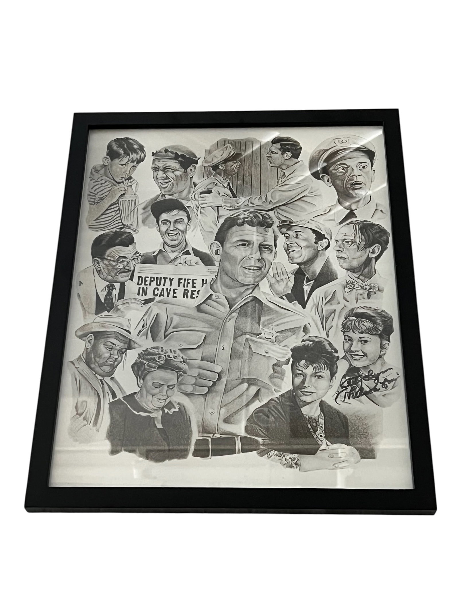 Framed Collage of Pencil Sketch Portraits from The Andy Griffith Show: This framed collage features pencil sketch portraits of iconic characters from The Andy Griffith Show.Key Characters FeaturedAndy Taylor (Andy Griffith) is the large central figure in his sheriff unif
