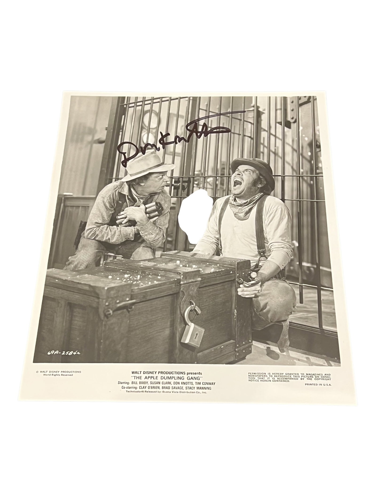 Signed Doin Knotts Photograph: This vintage black and white movie still features Don Knotts and Tim Conway in the 1975 film The Apple Dumpling Gang.The photo appears to be signed by Don Knotts, according to listings for similar
