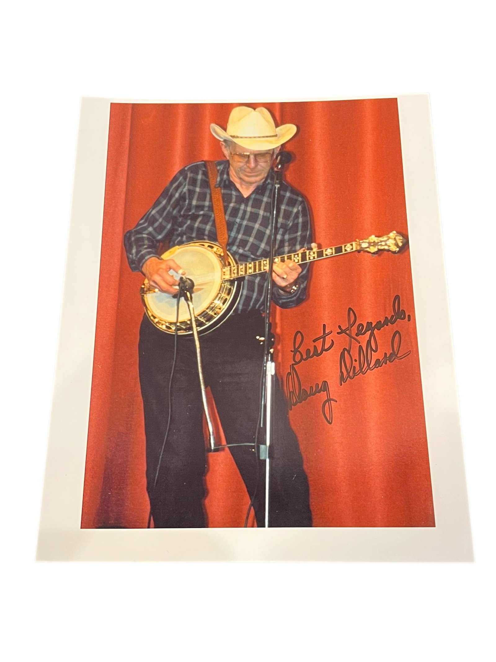 Signed Doug Dillard Photograph: This autographed promotional photo features renowned bluegrass musician Doug Dillard, famous for his role as one of "The Darlings" on The Andy Griffith Show. [1]Signature: The photograph is