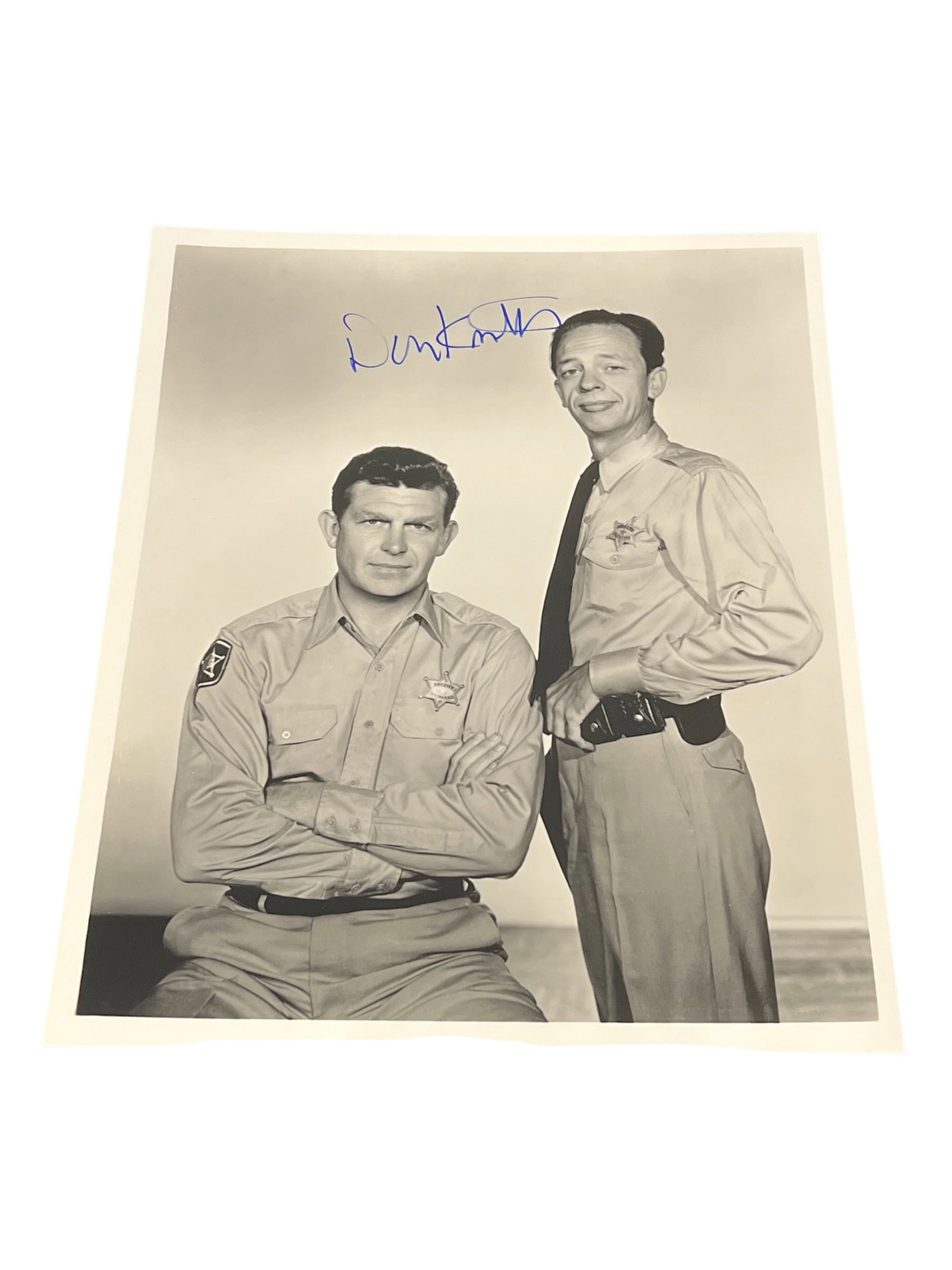 Signed Don Knotts Photograph: This image features a vintage 8x10 reprint photograph of Andy Griffith and Don Knotts from The Andy Griffith Show, showing the actors in their respective sheriff and deputy uniforms. [1, 2]This glossy