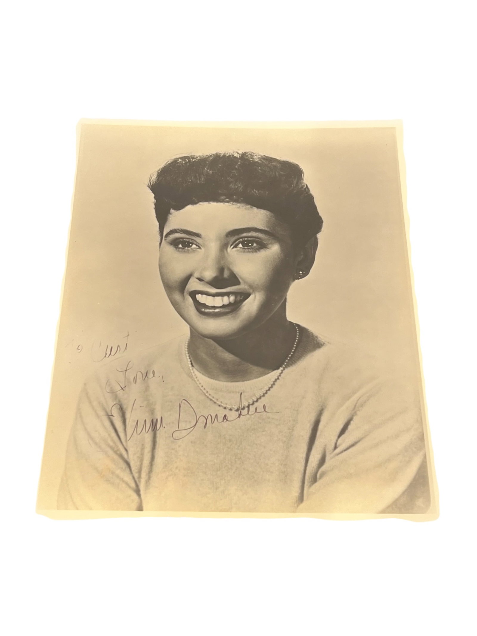 Signed Elinor Donahue Photograph: This image features a vintage autographed portrait of American actress Elinor Donahue. [1, 2]She is best known for her role as Betty Anderson on the 1950s sitcom Father Knows Best.The photo appears