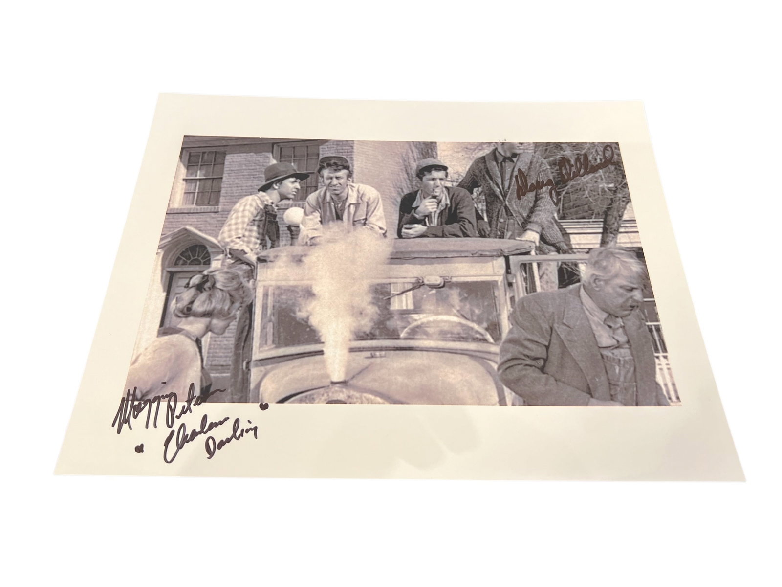 Signed Photograph: This image features a vintage, black-and-white promotional photograph from The Andy Griffith Show featuring the Darlin' family. [1]Scene: The photograph depicts the Darling clan in a truck, a