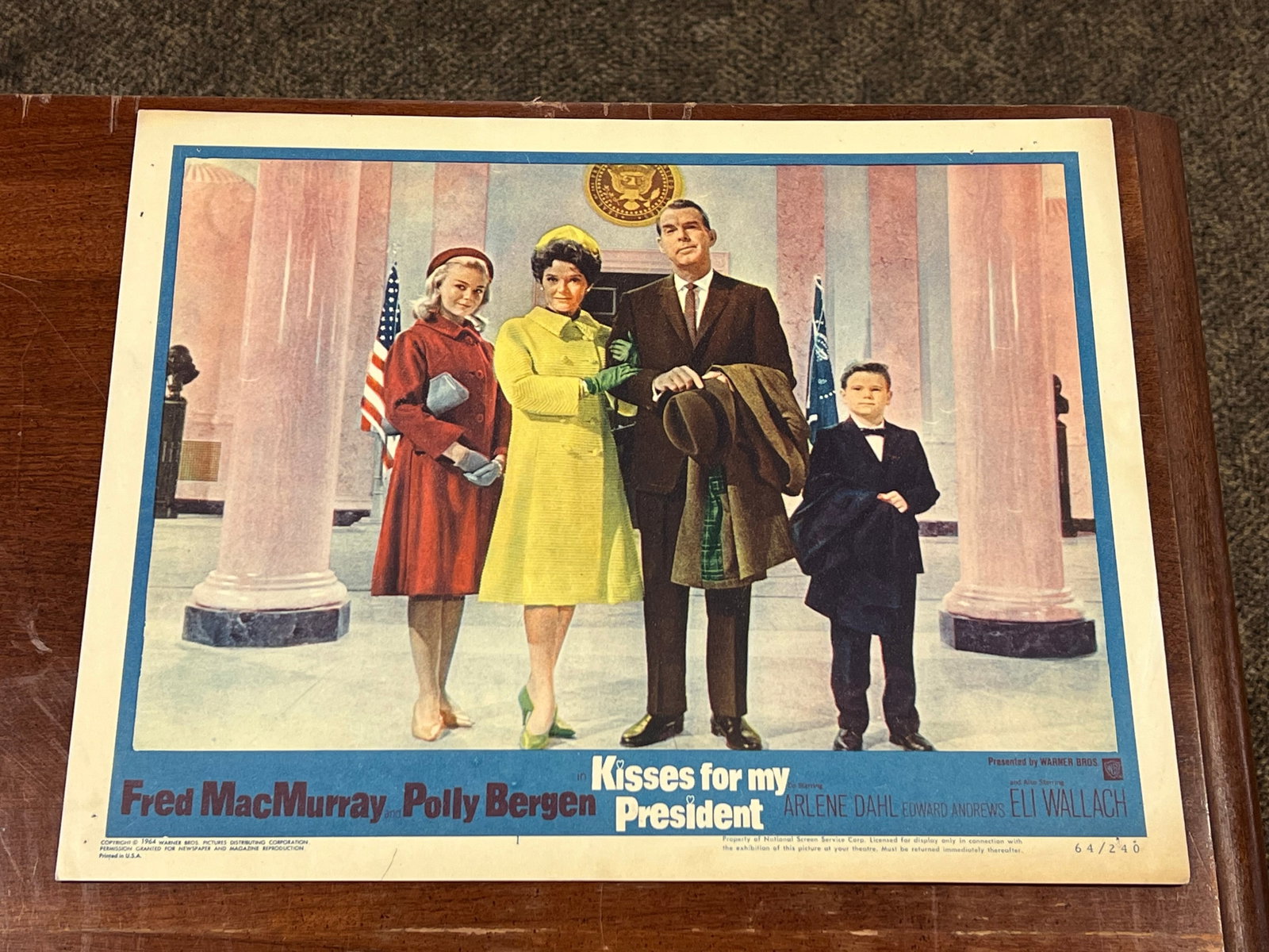 “Kisses For My President" Lobby Card: This item is an authentic 1964 theatrical lobby card measuring 11 inches by 14 inches for the Warner Bros. film Kisses for My President. [1, 2] measures 11 in x 14 in