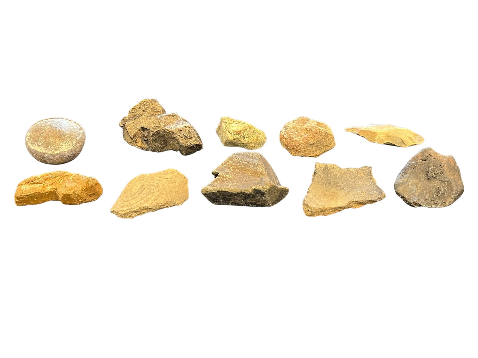 Lot of 10 Native American Artifacts: These specimens appear to be a collection of natural stones and sedimentary rocks, possibly including yellow jasper or dolostone.Some pieces in the set resemble rough, unpolished materials frequently