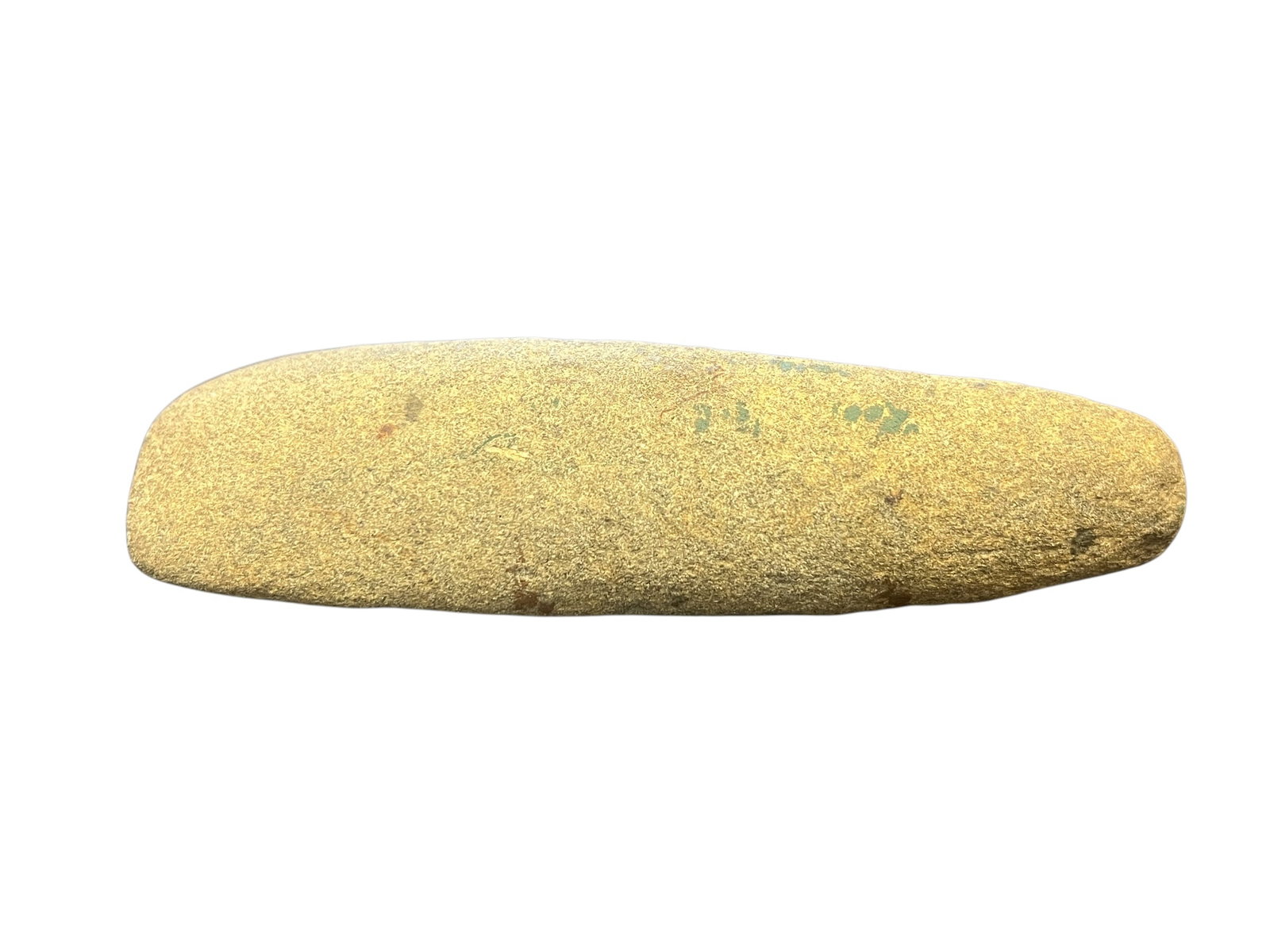 Native American Stone Celt: This object appears to be a stone artifact, possibly a Neolithic stone celt or axe head.It is similar in shape to prehistoric African or Native American stone pestles and grinding tools.Such