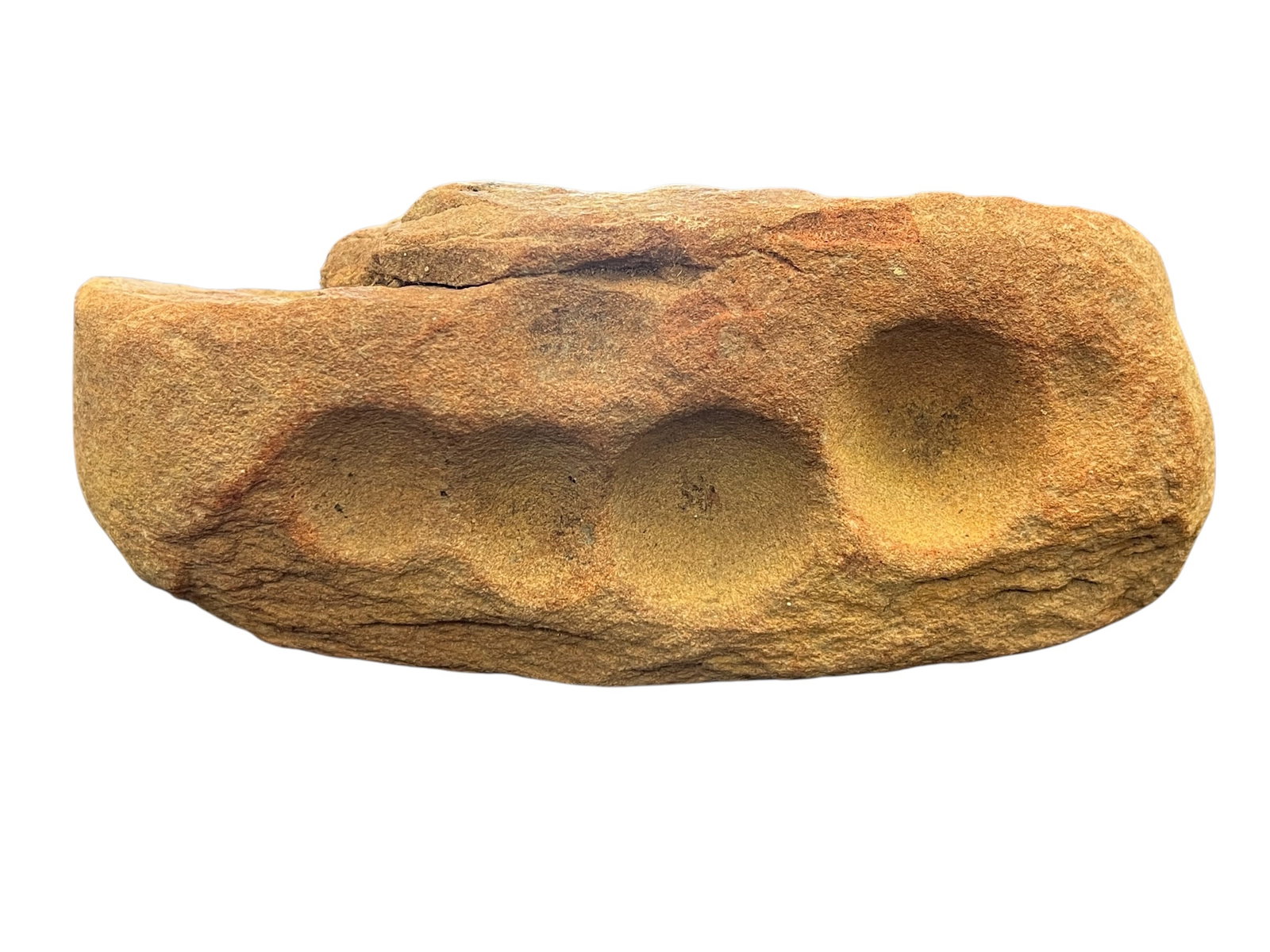 Native American Nutting Stone: This item is likely a Native American nutting stone or cupstone artifact, characterized by intentionally carved circular depressions used for cracking nuts or grinding seeds. [1, 2]Similar items are f