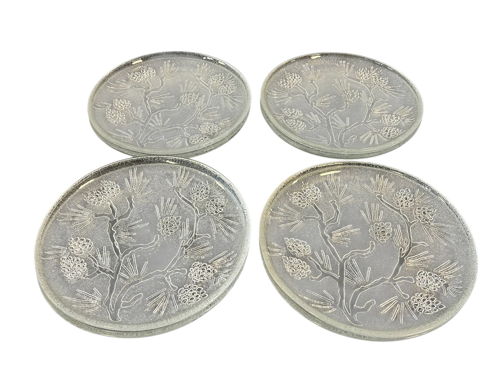Lot of 8 Ponderosa Pine Pattern Glass Plates: This is a set of four vintage clear glass plates in the Ponderosa Pine pattern, manufactured by the Indiana Glass Company for their Tiara Exclusives line. Introduced primarily during the late 1970s