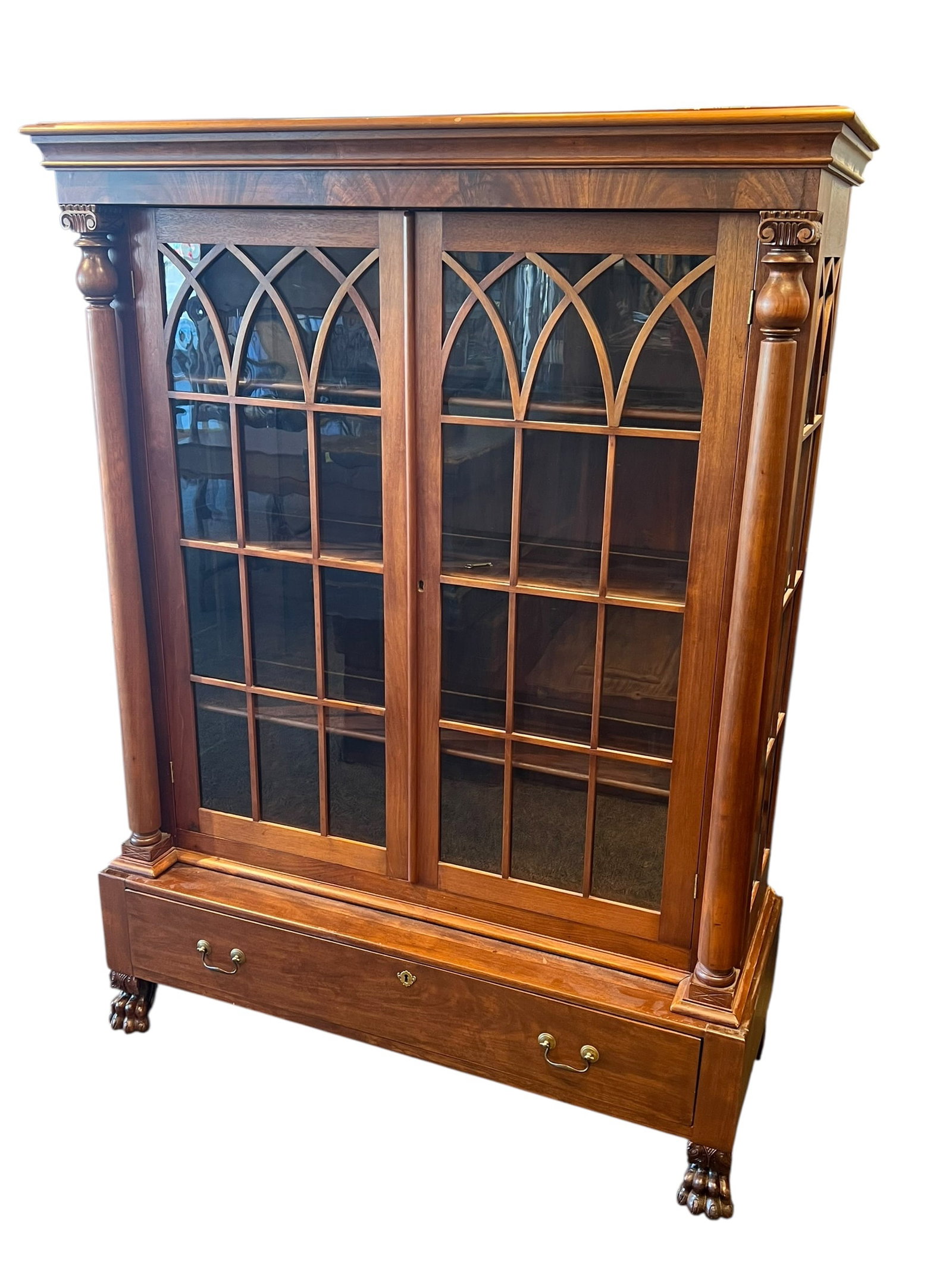 2 Pc. Mahogany 2 Door China Cabinet: This stunning furniture piece is an antique American Empire or Regency Revival mahogany bookcase cabinet dating from the late 19th century to early 20th century. [1]Distinctive Style
