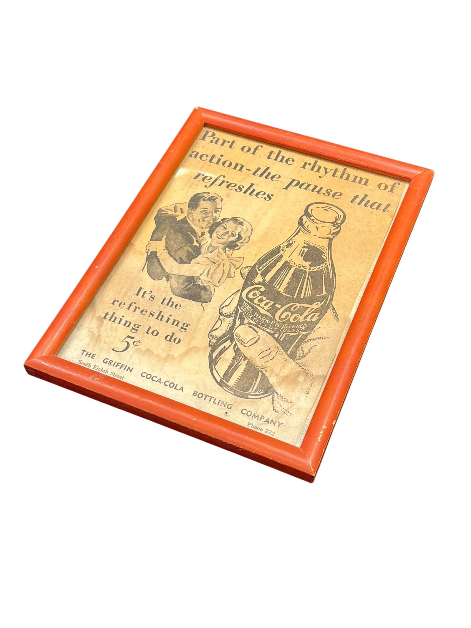 Coca Cola Framed Advertisement: This image shows a vintage, framed mid-20th-century Coca-Cola promotional advertisement featuring the iconic "the pause that refreshes" slogan and a 5-cent bottle graphic. [1, 2]Ad Slogan: Features