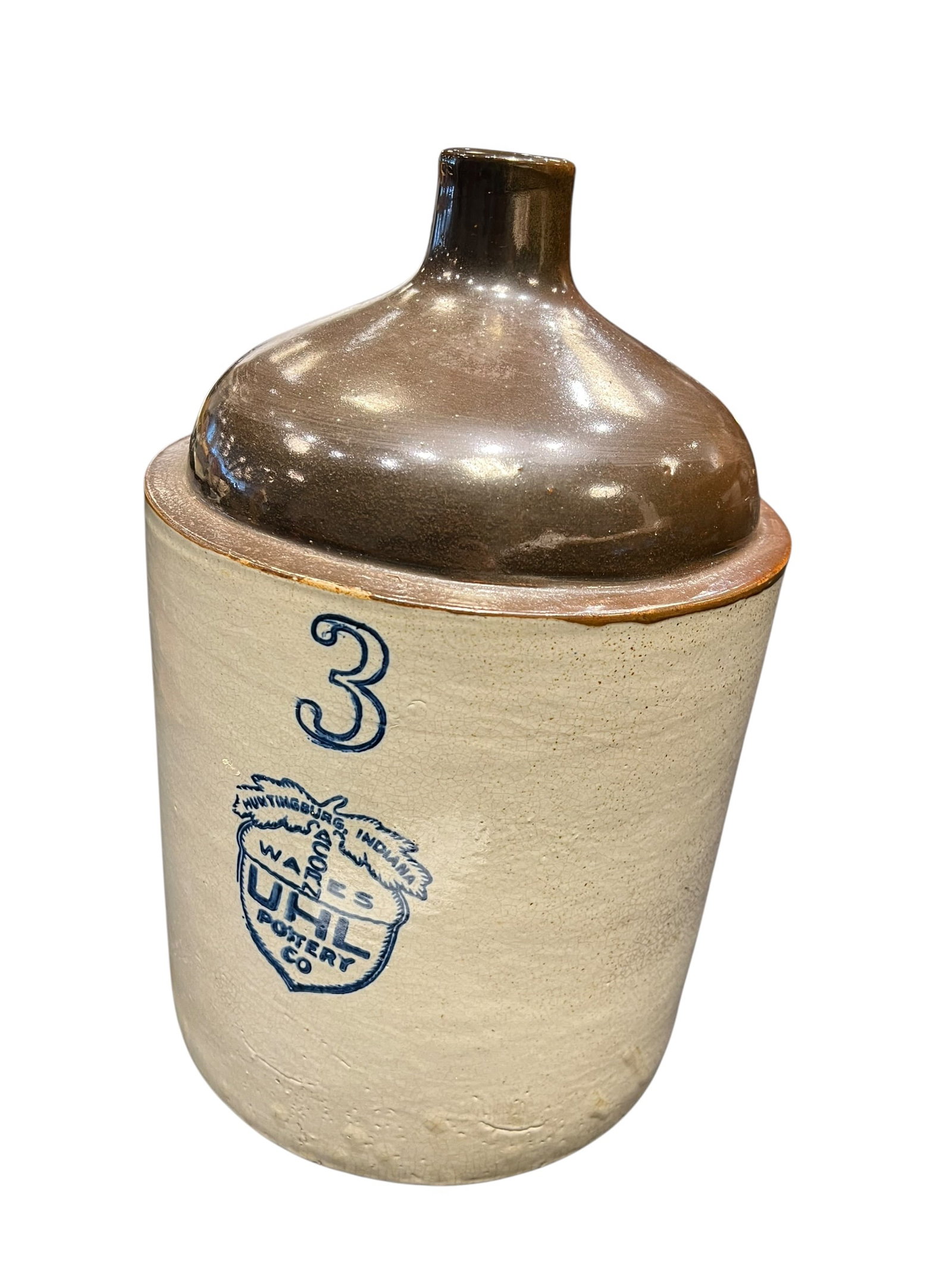 3 Gallon UHL Pottery Stoneware Crock: This antique 3-gallon shoulder jug was manufactured by the Uhl Pottery Company in Huntingburg, Indiana, featuring their cobalt blue "Acorn Wares" shield stamp and capacity marking from the early 20th 
