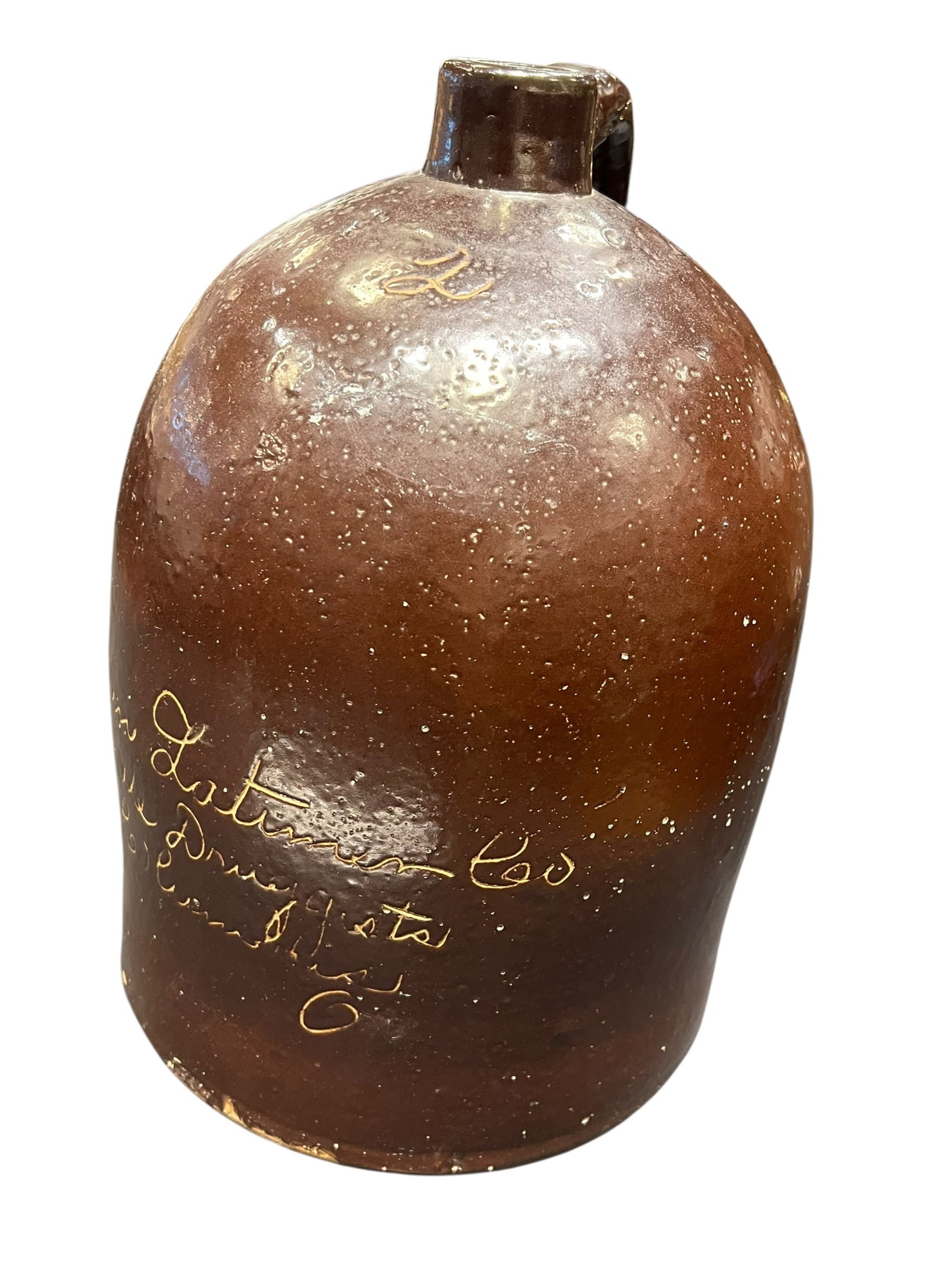 2 Gallon American Stoneware Script Jug: This is an antique American alkaline- or brown-slip-glazed stoneware advertising whiskey jug from the late 19th or early 20th century, featuring a single pulled handle, a ring-turned spout, and hand-s