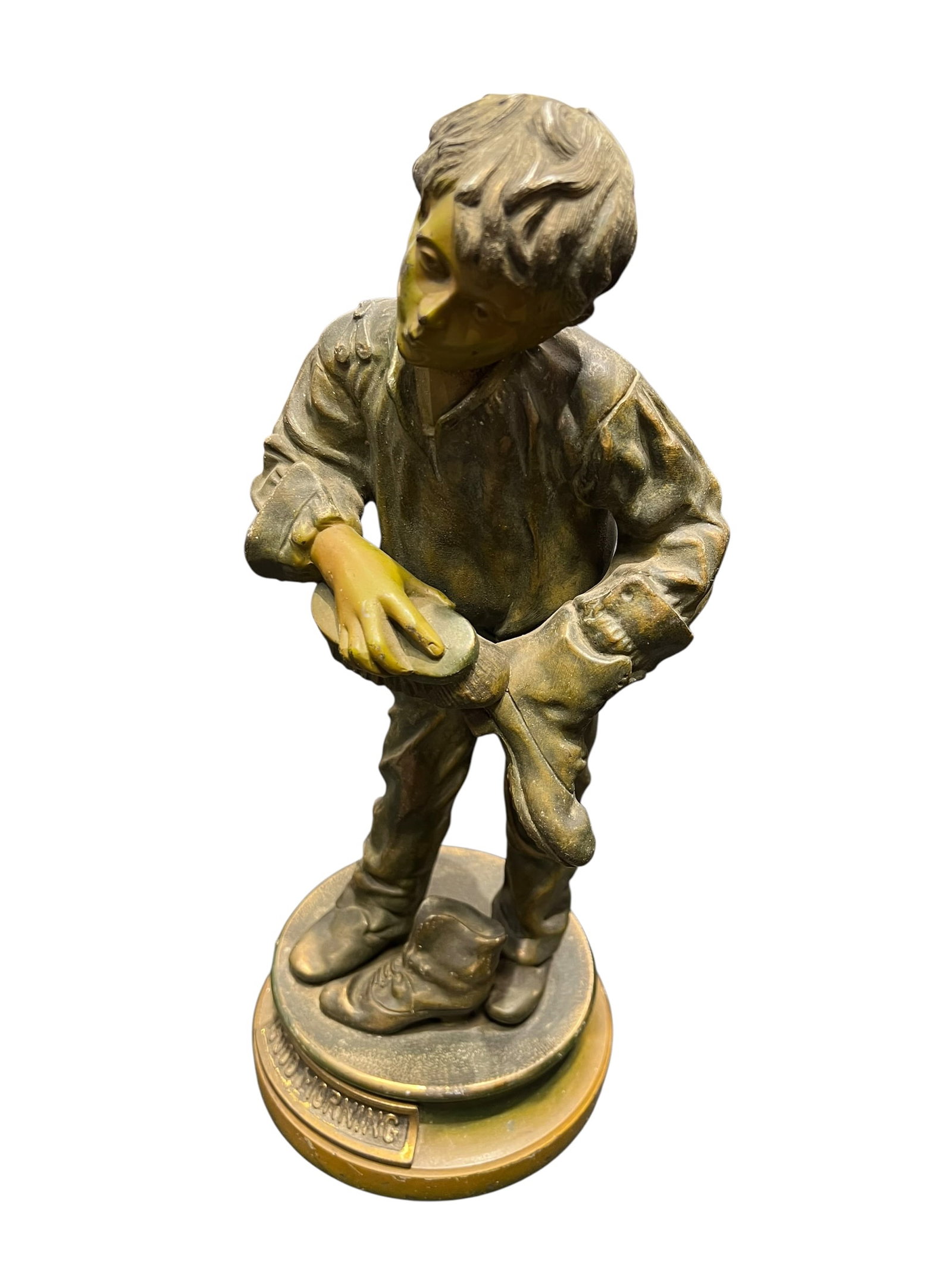 Good Morning or Bootblack Shoeshine Boy Figural Sculpture: This antique figural sculpture appears to be a patinated cast metal (bronze-toned spelter or bronze) desk or shelf statue depicting a young bootseller or bootblack boy shining a shoe, with a plaque