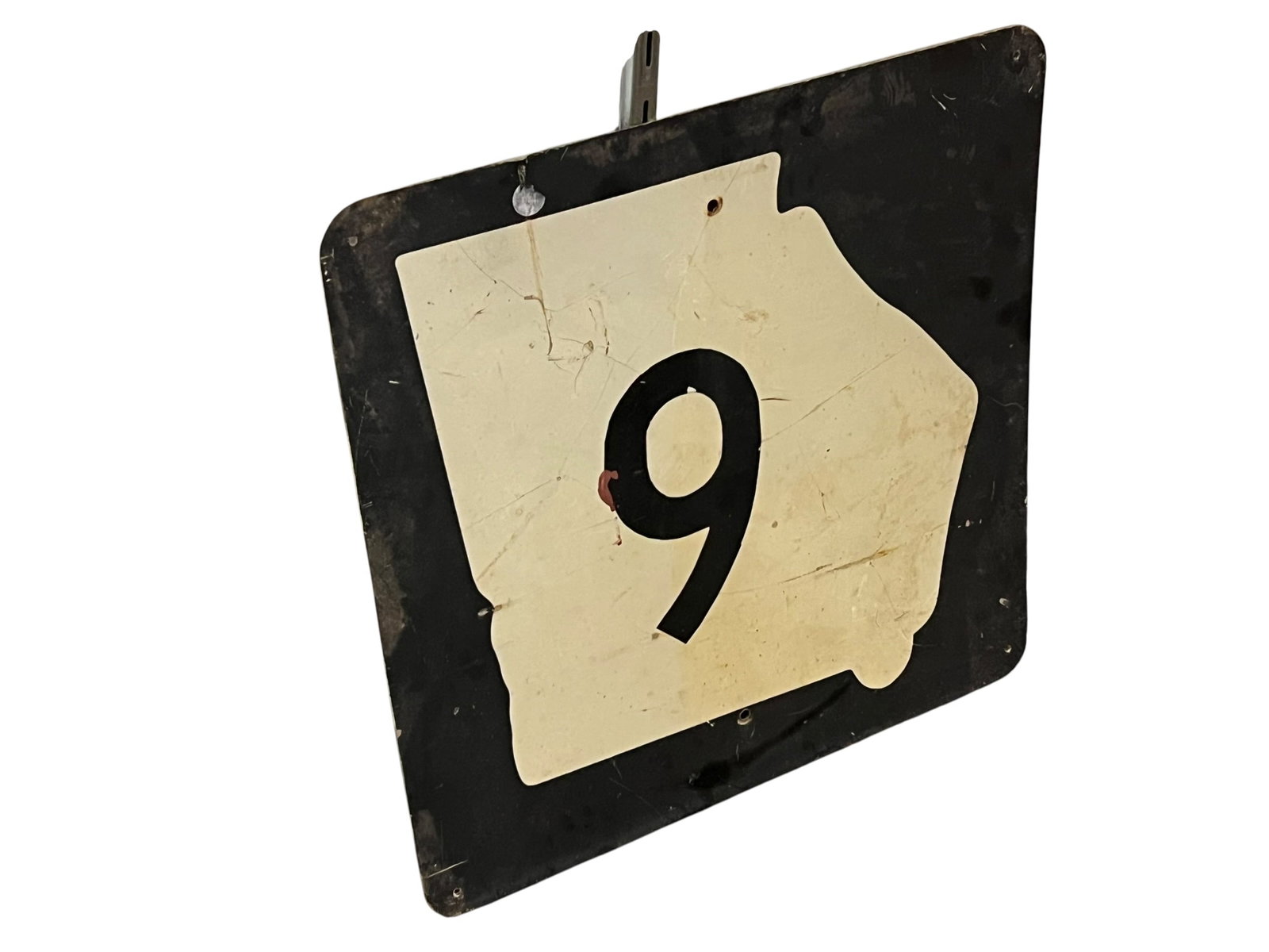 Retired Rout 9 Highway Route Sign: The object shown is a vintage Georgia State Route 9 highway marker featuring the classic white state-outline cutout with a black number 9 mounted on a dark backing plate. [1]Design: Features the iconi