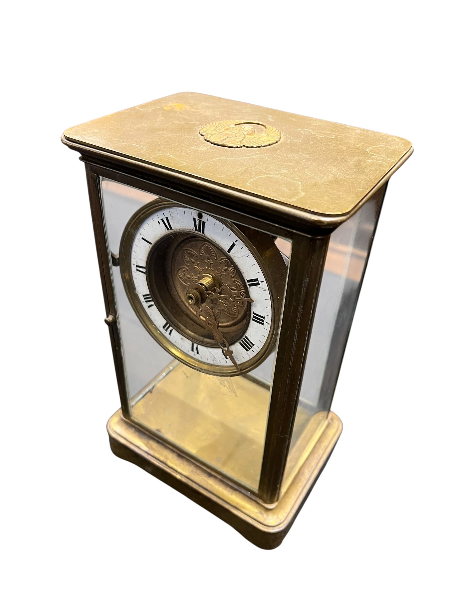 Tiffany & Co. Brass and Crystal Battery Operated Mantle Clock: This is an antique crystal regulator mantel clock, typically featuring a brass or gilt-metal frame with beveled glass panels on the front, back, and sides to showcase the internal mechanical movement.