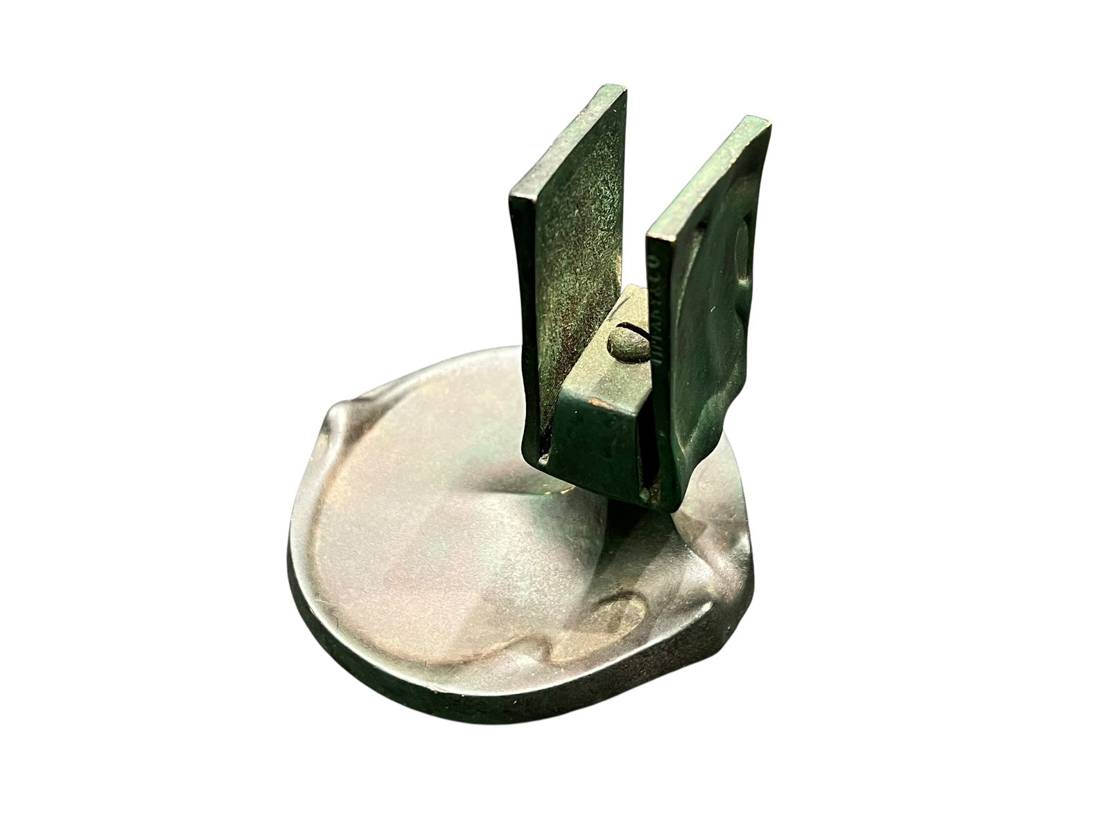 Tiffany Brass Desktop Matchbox Clip Stand: This object is an antique brass desk accessory, specifically a Victorian-style paper clip or letter holder mounted on a weighted base.It features a spring-loaded jaw or clip mechanism designed to