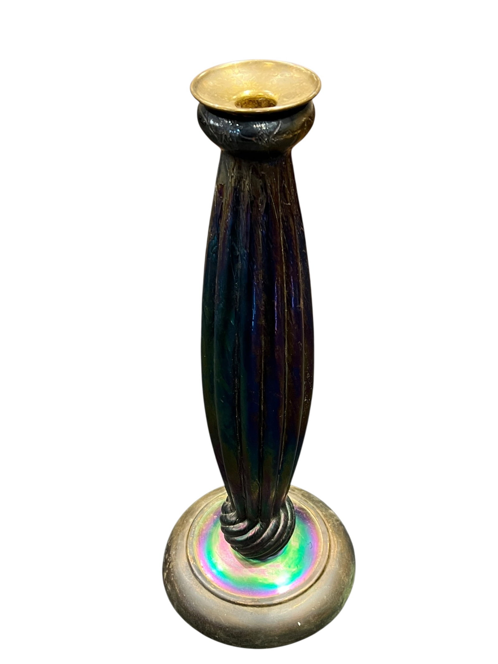 Loetz Art Glass Candle Holder: This image features an Art Nouveau iridescent glass candlestick, which strongly aligns with the famous Favrile glass creations developed by Louis Comfort Tiffany for Tiffany Studios. [1, 2]