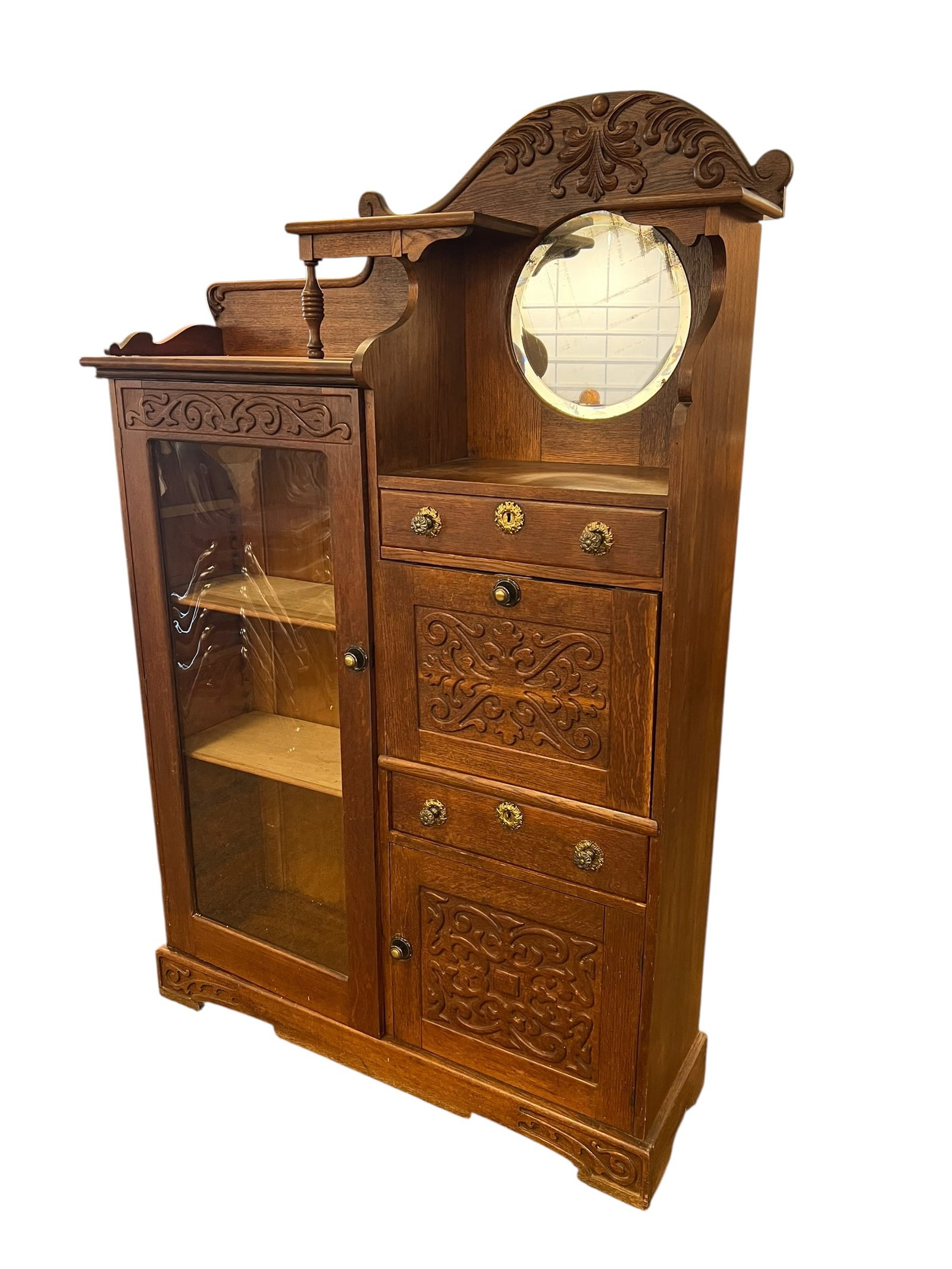 Oak Side by Side Secretary: This item is an antique early-20th-century American Victorian or Edwardian quarter-sawn oak "side-by-side" combination secretary desk and curio/bookcase cabinet, featuring an integrated round mirror,