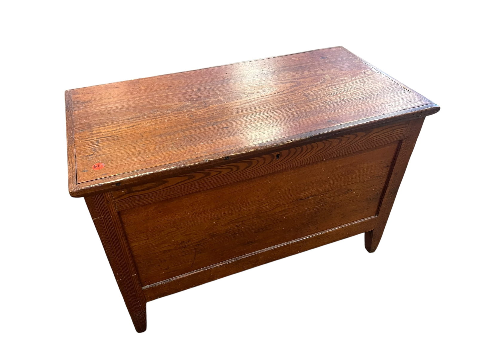 Blanket Chest: This antique wooden blanket chest or six-board storage trunk features a warm reddish-brown patina and tapered feet. [1, 2]Material & Style: Solid wood construction, commonly heart pine or primitive