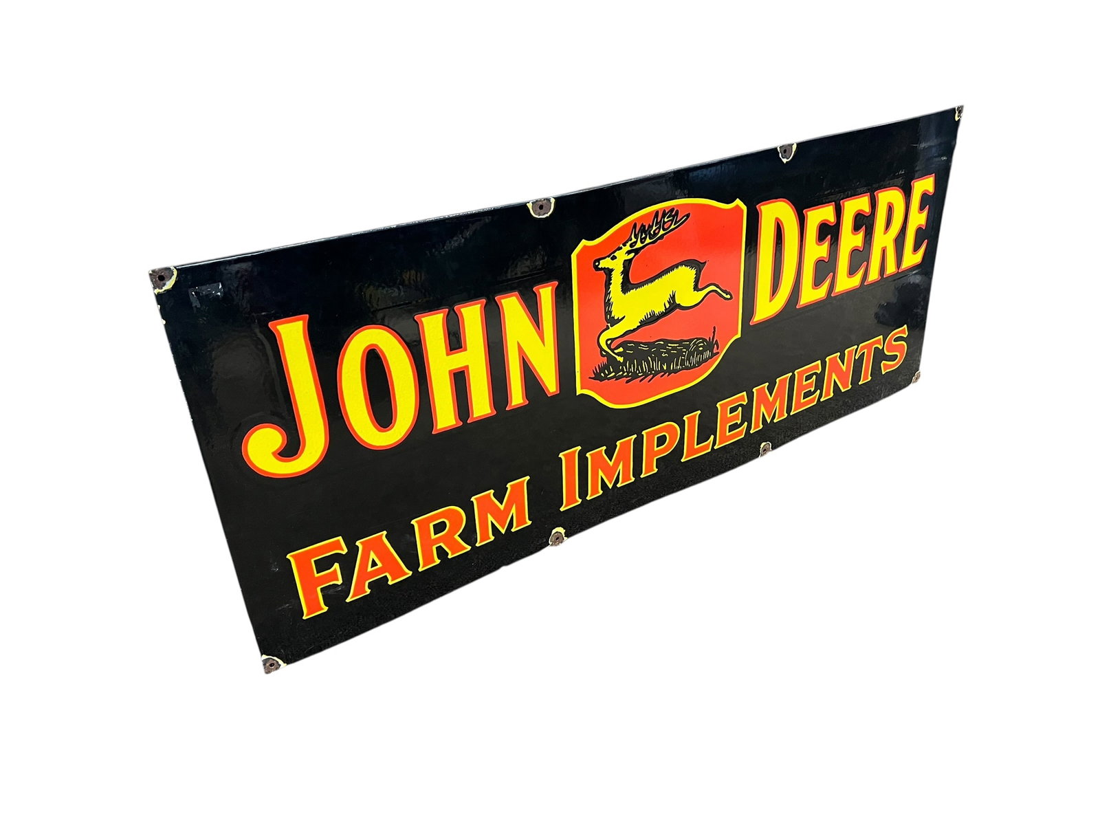 John Deere Porcelain Advertising Sign: The image shows an vintage style 1930s John Deere "Farm Implements" single-sided porcelain dealership sign featuring the iconic leaping deer logo on a red-and-yellow shield against a black
