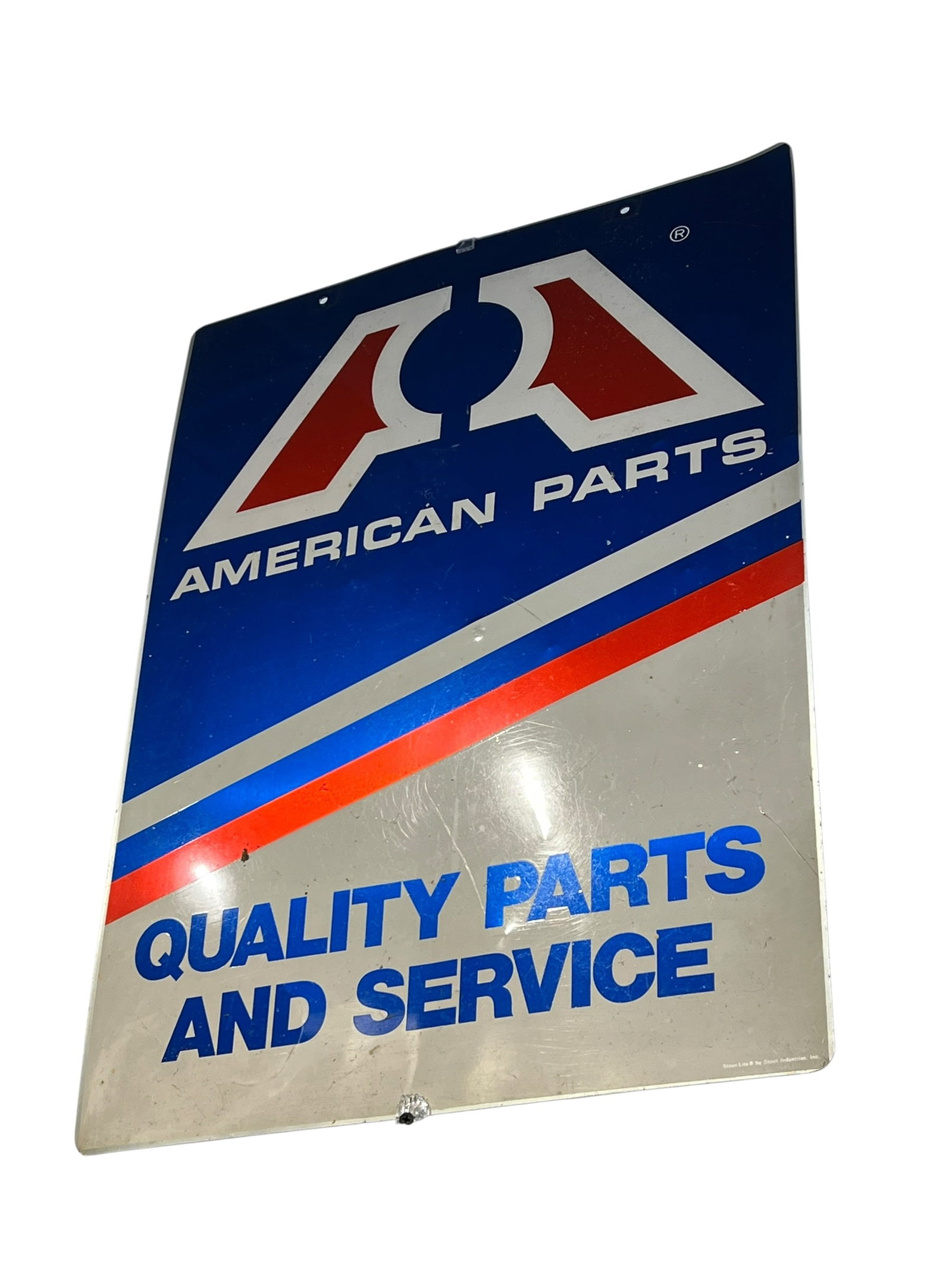American Parts Metal Advertising Sign: The image shows a vintage metal or tin advertising sign for American Parts featuring the classic "Big A" style red, white, and blue logo with the text "Quality Parts and Service."Brand/Origin: