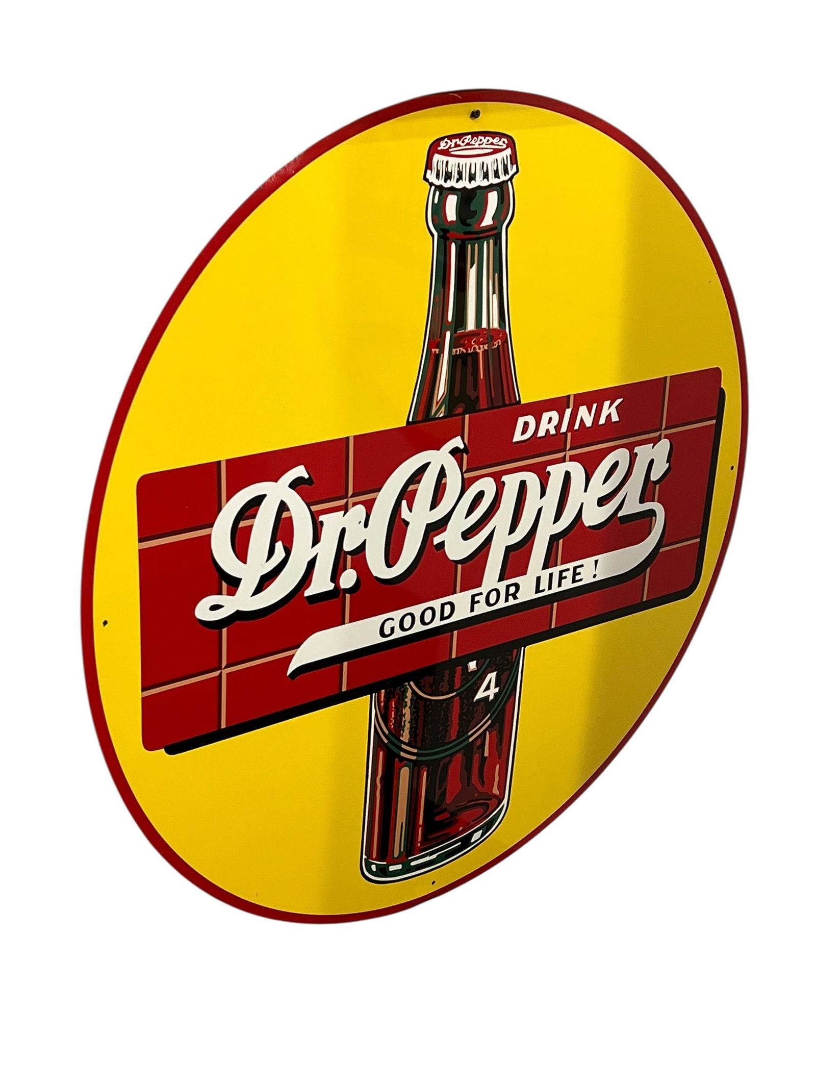 Dr. Pepper Metal Advertising Sign: Item: Vintage-style round "Drink Dr. Pepper - Good For Life!" advertising sign featuring a classic soda bottle and yellow background.Design Elements: Features the iconic 1930s-style red brick logo pan