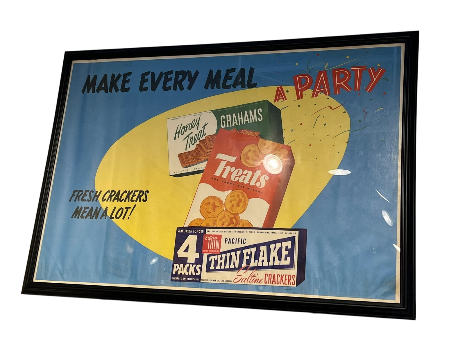 This Saltines Crackers Advertising Poster: This framed vintage advertising print features a mid-century retro design with the slogan "Make Every Meal a Party" and graphics for classic Nabisco crackers including Pacific Thin Flake and Honey Tre