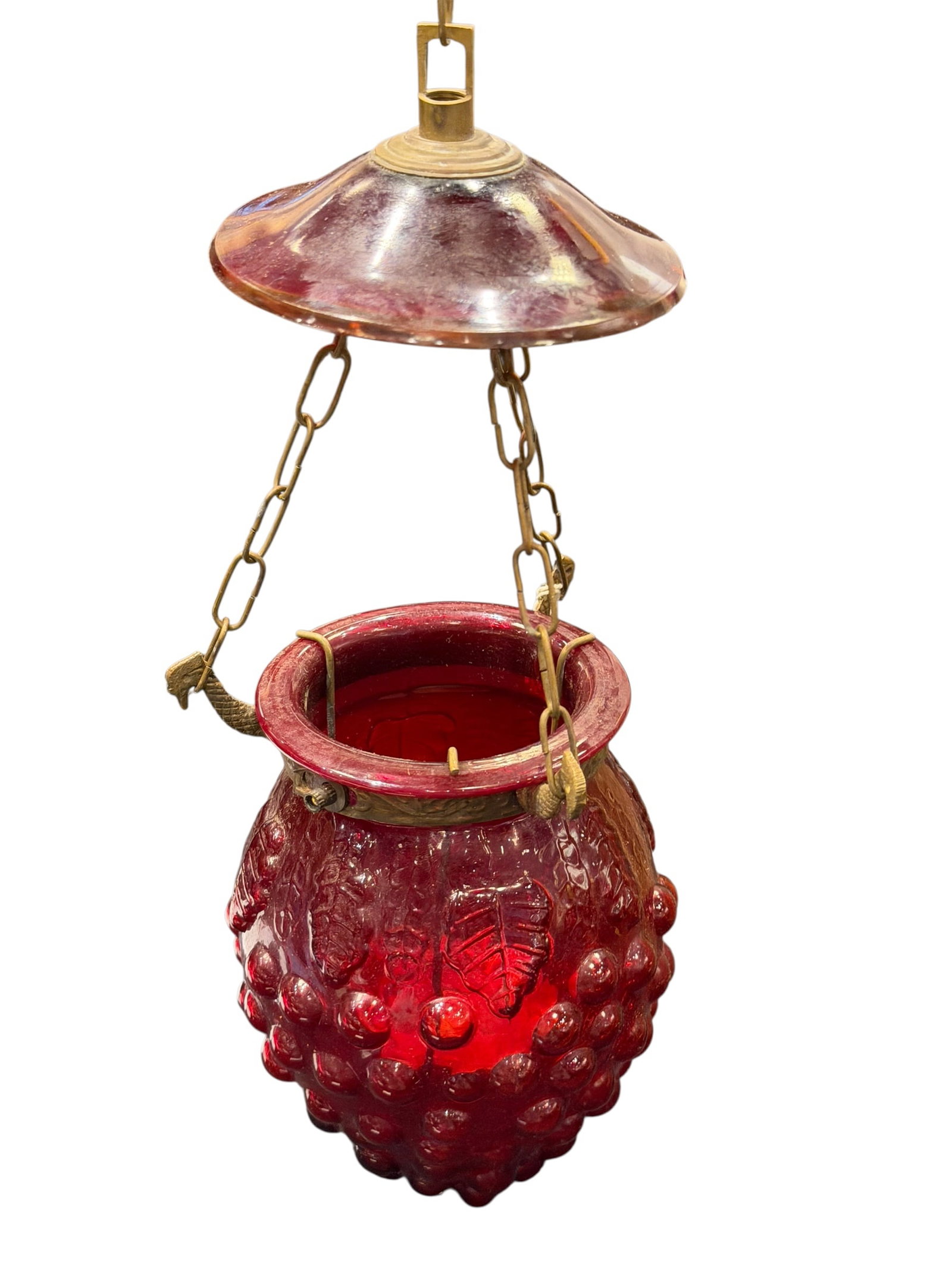 Vintage Hanging Ruby Red Candle Lamp: This is a vintage or antique hanging candle lamp featuring a wine-red/cranberry hobnail glass lantern body.It is designed with ornate brass hardware, matching suspension chains, and a decorative match