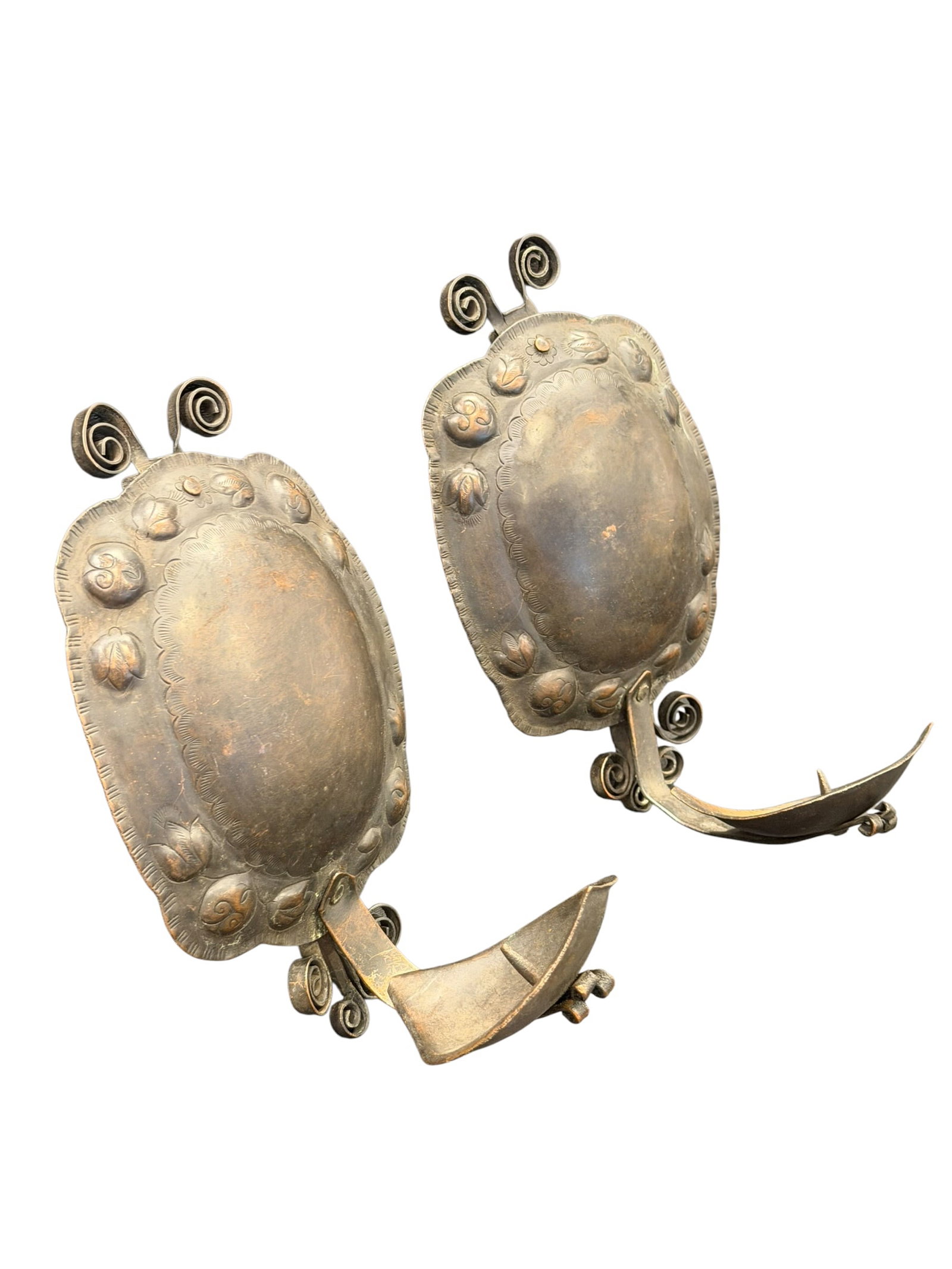 Pair of Roycroft Hand Hammered Copper Sconces: This image displays a stunning pair of antique candle wall sconces featuring traditional European repoussé metalwork. [1]Key Design Elements & FeaturesRepoussé Backplates: The large, oval-shaped bac