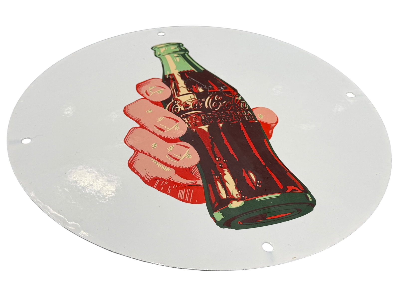 Porcelain Coca Cola Advertising Sign: Item Identification: This is a 1950s Coca-Cola porcelain button sign, featuring an iconic graphic of a hand holding a green glass contour bottle against a white background. [1, 2]Design & Features: Th