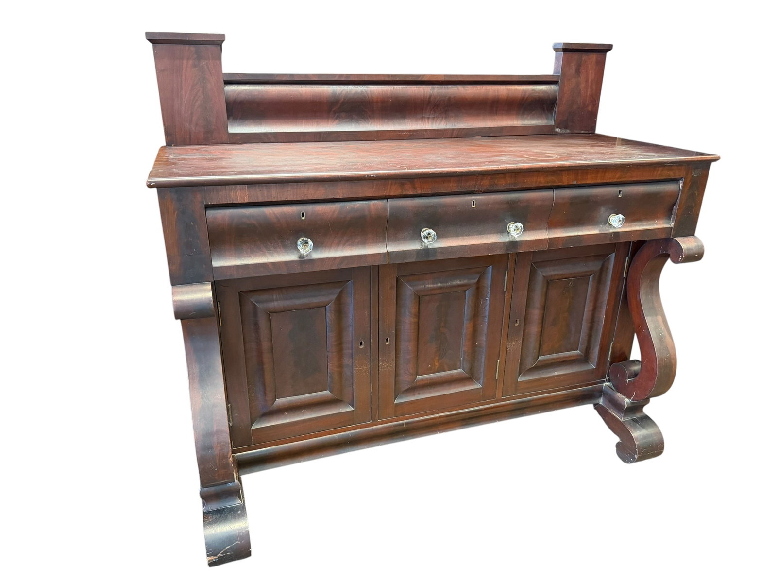 Mahogany Empire Sideboard: This piece of furniture is an American Empire style mahogany sideboard (also referred to as a buffet or server), dating from the mid-to-late 19th century. [1, 2]Key Identification FeaturesWood &