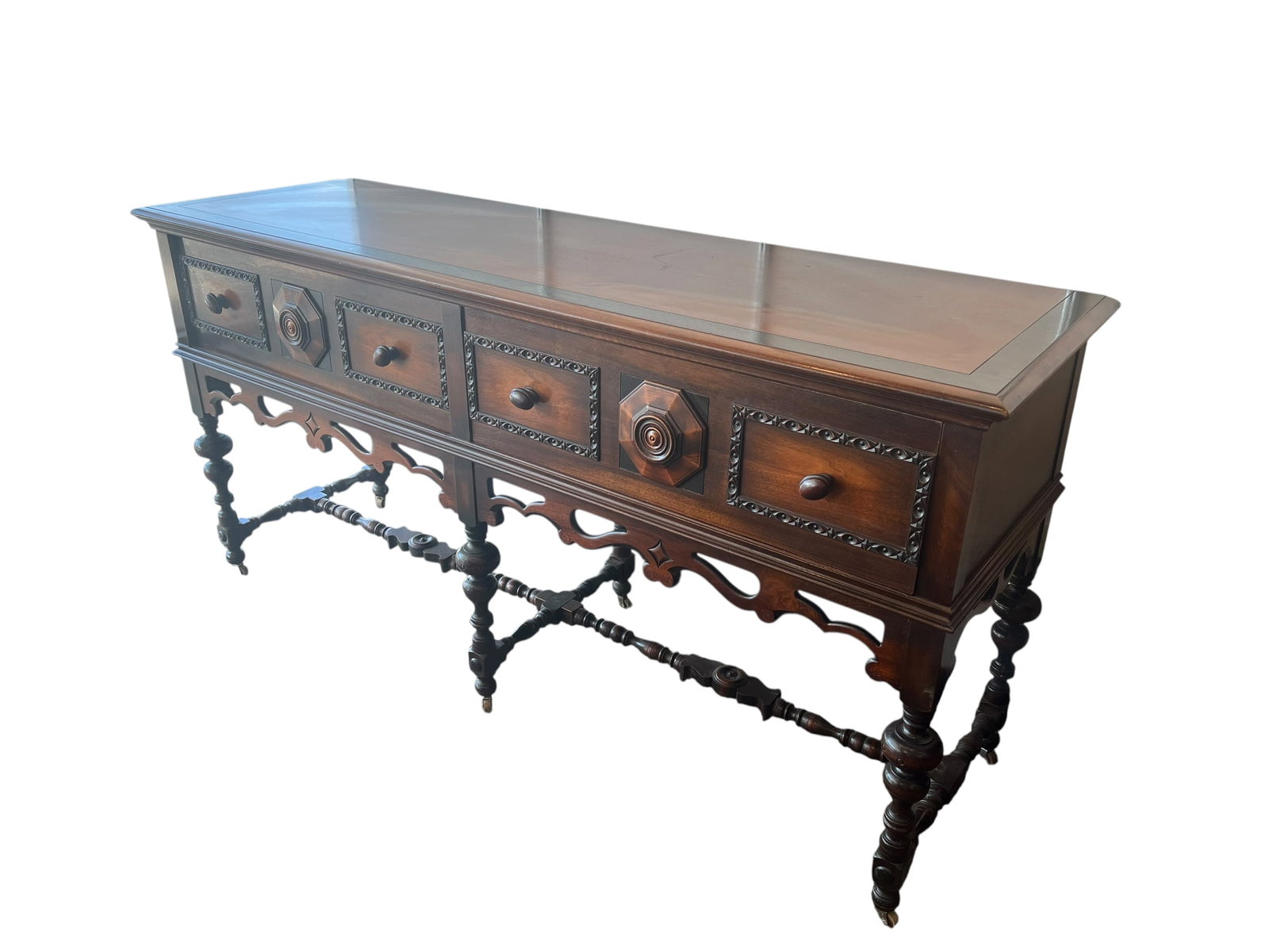 Walnut Jacobean Style Sideboard: This piece of furniture is an antique English Jacobean style ornate carved walnut and burl wood sideboard buffet. It was manufactured in the United States by the highly collectible and renowned