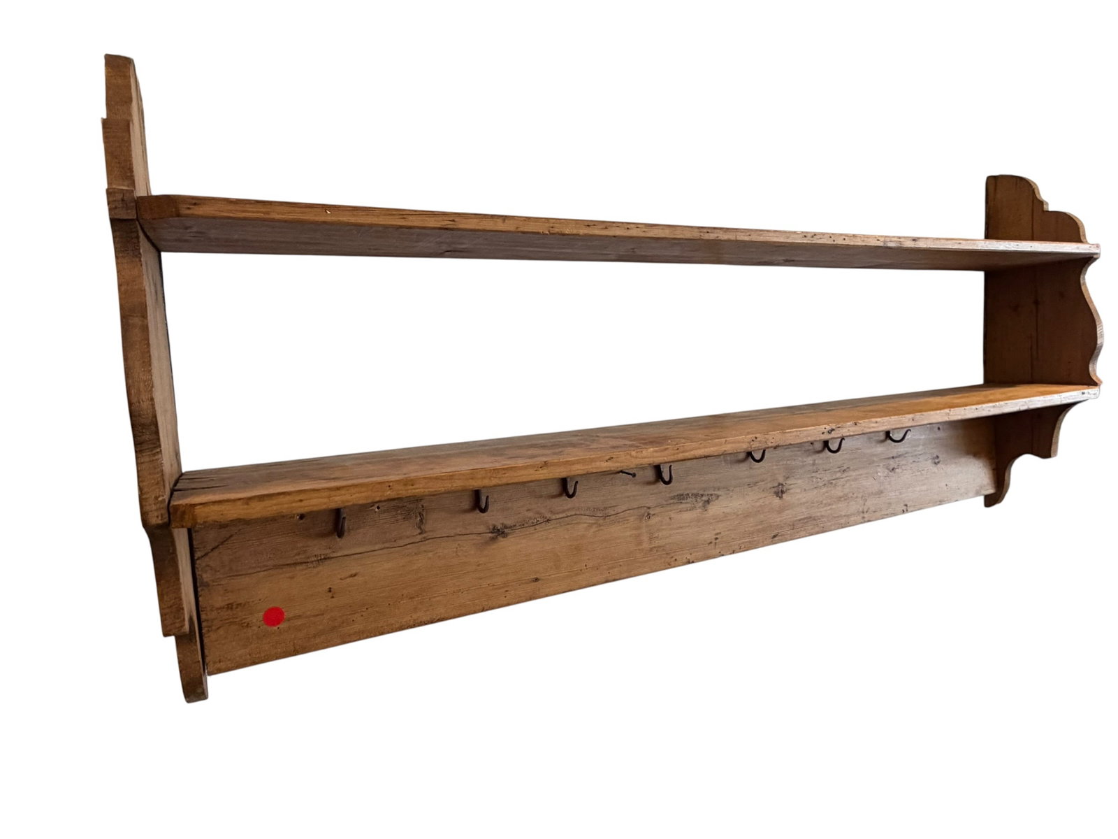 Early Wooden Hanging Shelf and Coat Rack: This item is an antique French country pine wall shelf designed with a built-in coat rack. It features a large, elongated structure with two open storage tiers and a row of hand-forged blacksmith hook