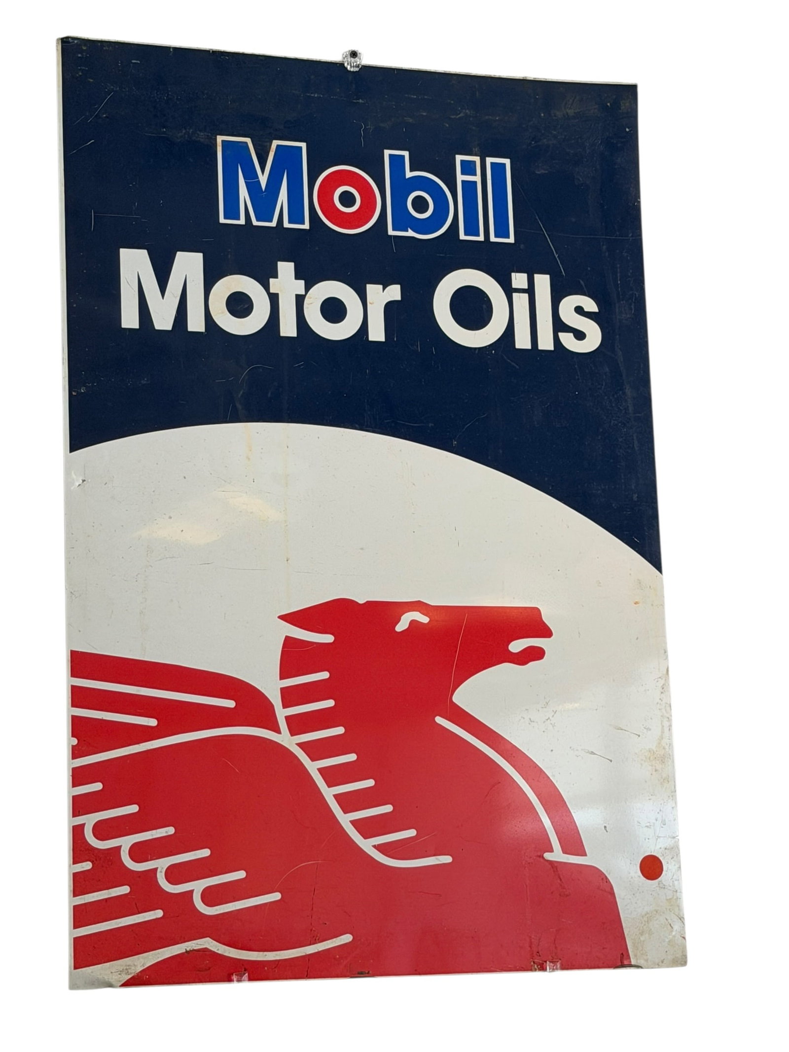Mobil Motor Oils Metal Advertising Sign: The image shows a vintage-style Mobil Motor Oils metal sign featuring the iconic red flying Pegasus logo.It has a white, blue, and red color scheme with "Mobil" in blue lettering outlined in white