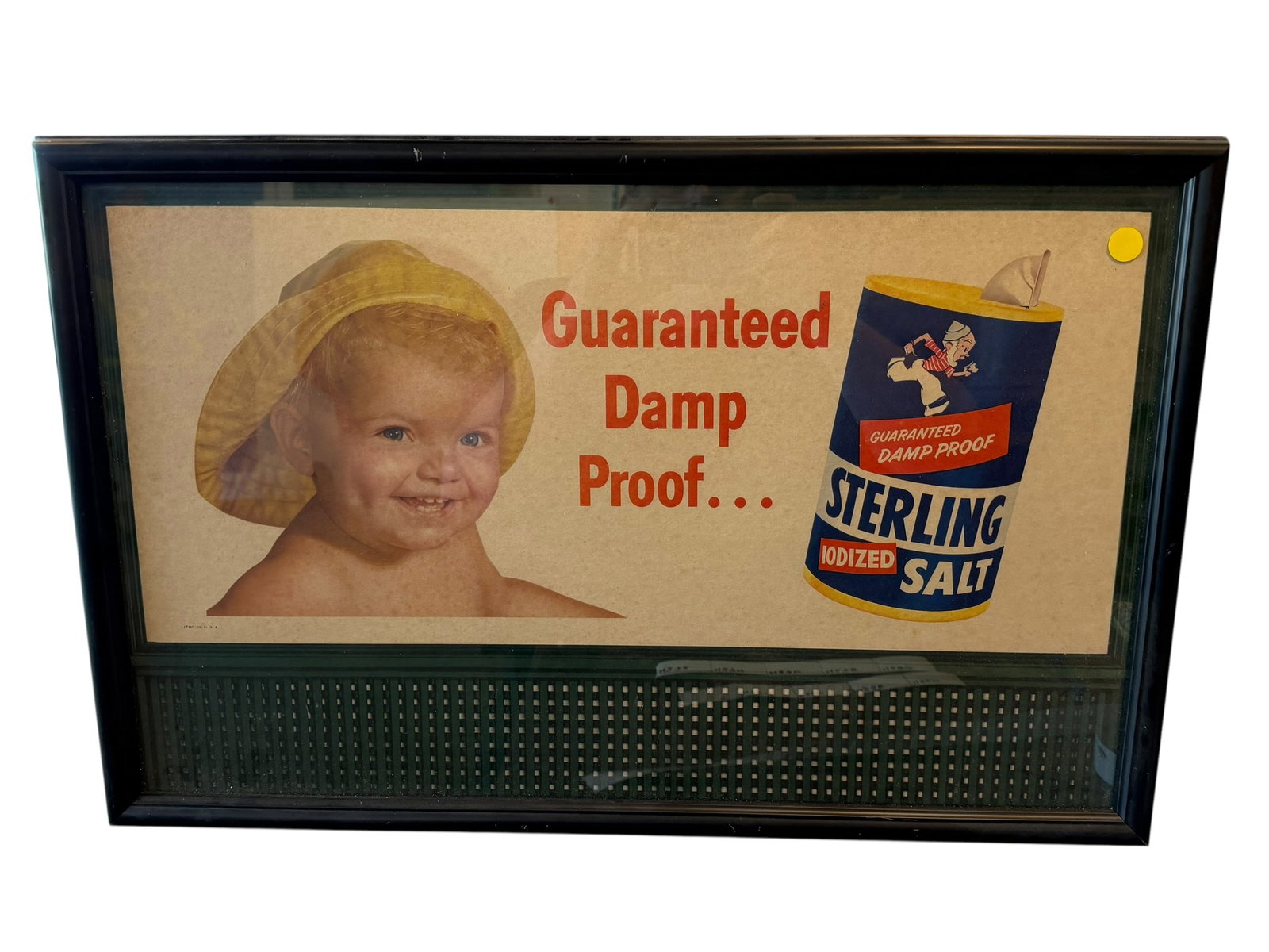 Sterling Salt Advertisng Poster: This framed vintage advertisement appears to be a mid-20th-century print for Sterling Iodized Salt by the International Salt Company, featuring the tagline "Guaranteed Damp Proof" alongside a smiling