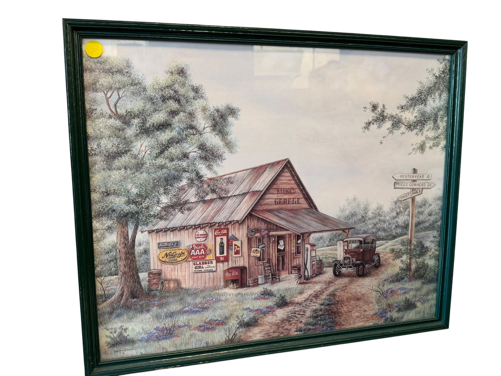 “Mike’s Garage?? Print by Kay Lamb Shannon: This framed vintage-style art print appears to be "Mike's Garage" by artist Kay Lamb Shannon, showcasing a nostalgic rural garage scene decorated with classic Coca-Cola and soda signage. [1, 2]It feat