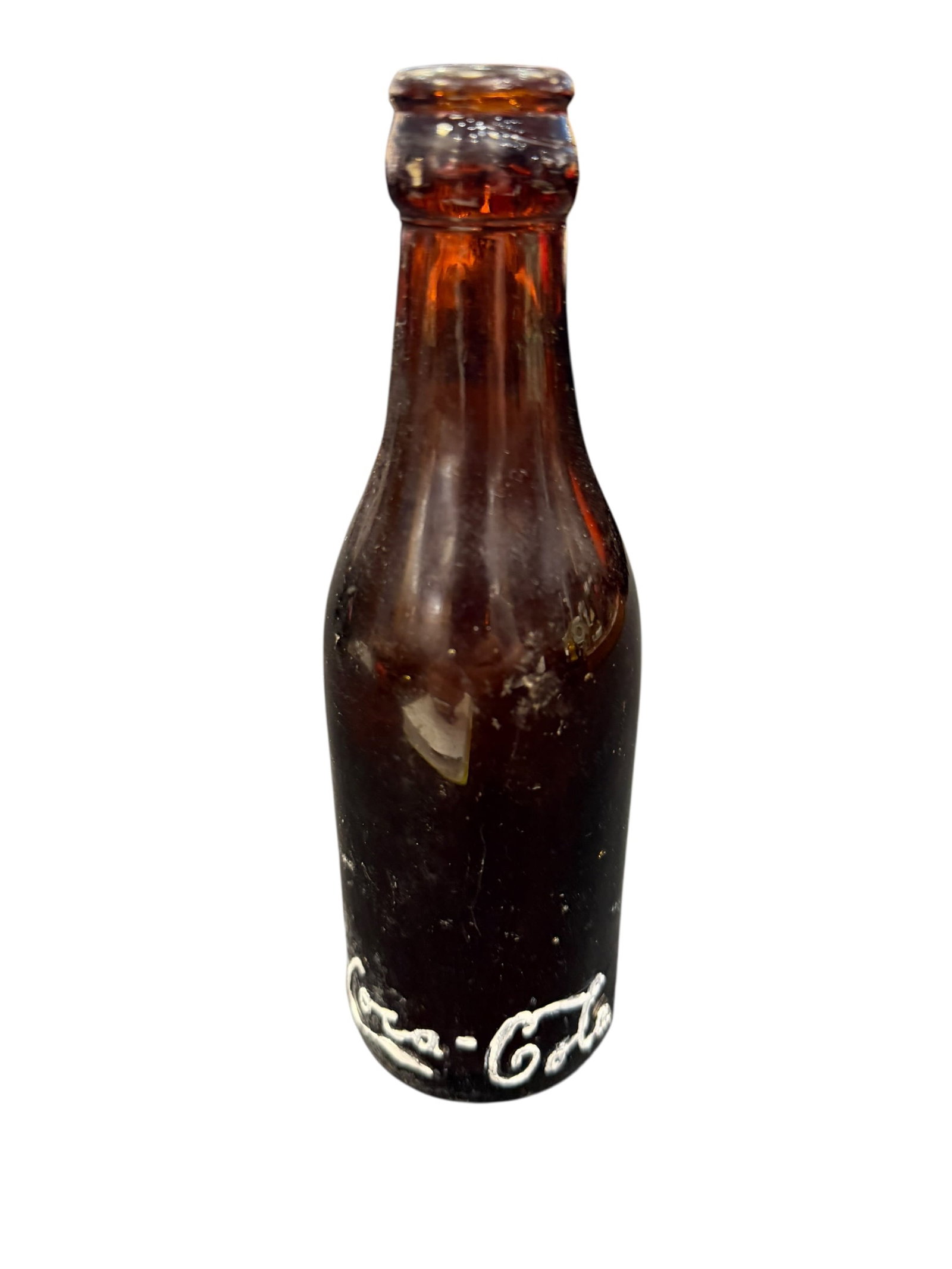 Antique Amber Glass Straight Side Coca Cola Bottle: The object appears to be an antique, straight-sided amber glass Coca-Cola bottle, likely manufactured by the Root Glass Company around 1900–1915 featuring an embossed script logo near the base. [1,