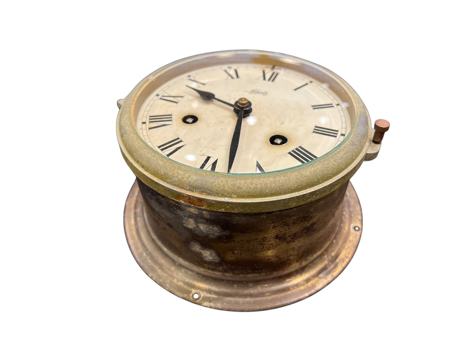 Brass Clock: The image appears to show a vintage Schatz Royal Mariner Ship's Bell Clock, a mechanical maritime timepiece crafted from brass with a white dial and black Roman numerals. [1, 2, 3]Maker: August