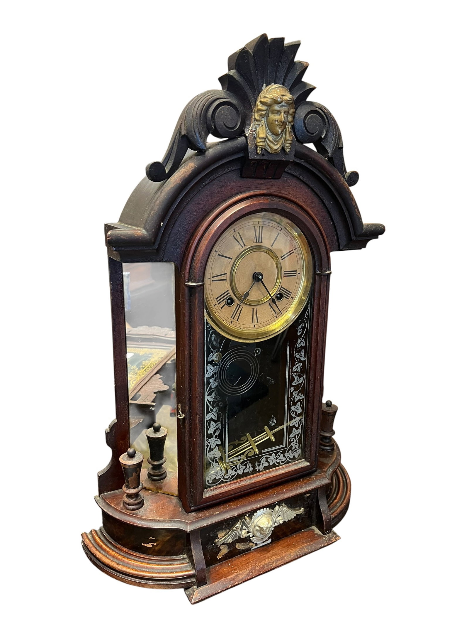 Walnut Mantle Clock: This appears to be an antique late-19th-century American walnut mantel or shelf clock, closely resembling the popular "Triumph" or "Monarch" style models produced by the Ansonia Clock Co. or similar m