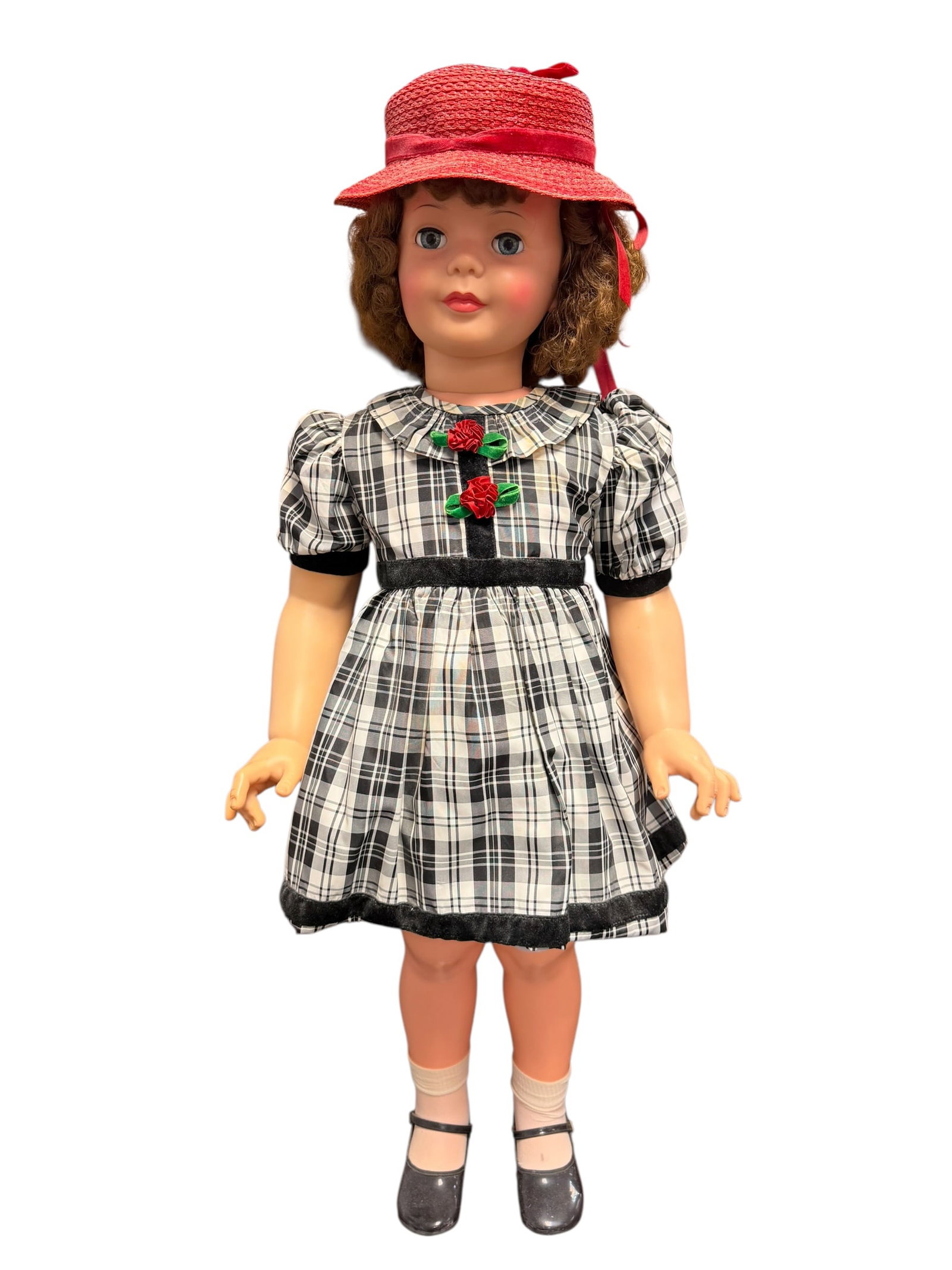 Ideal Playpal Vinyl Doll: This vintage doll strongly resembles a classic 1940s or 1950s walk-and-turn composition doll, highly characteristic of popular makers of that era such as Madame Alexander or Effanbee.She features
