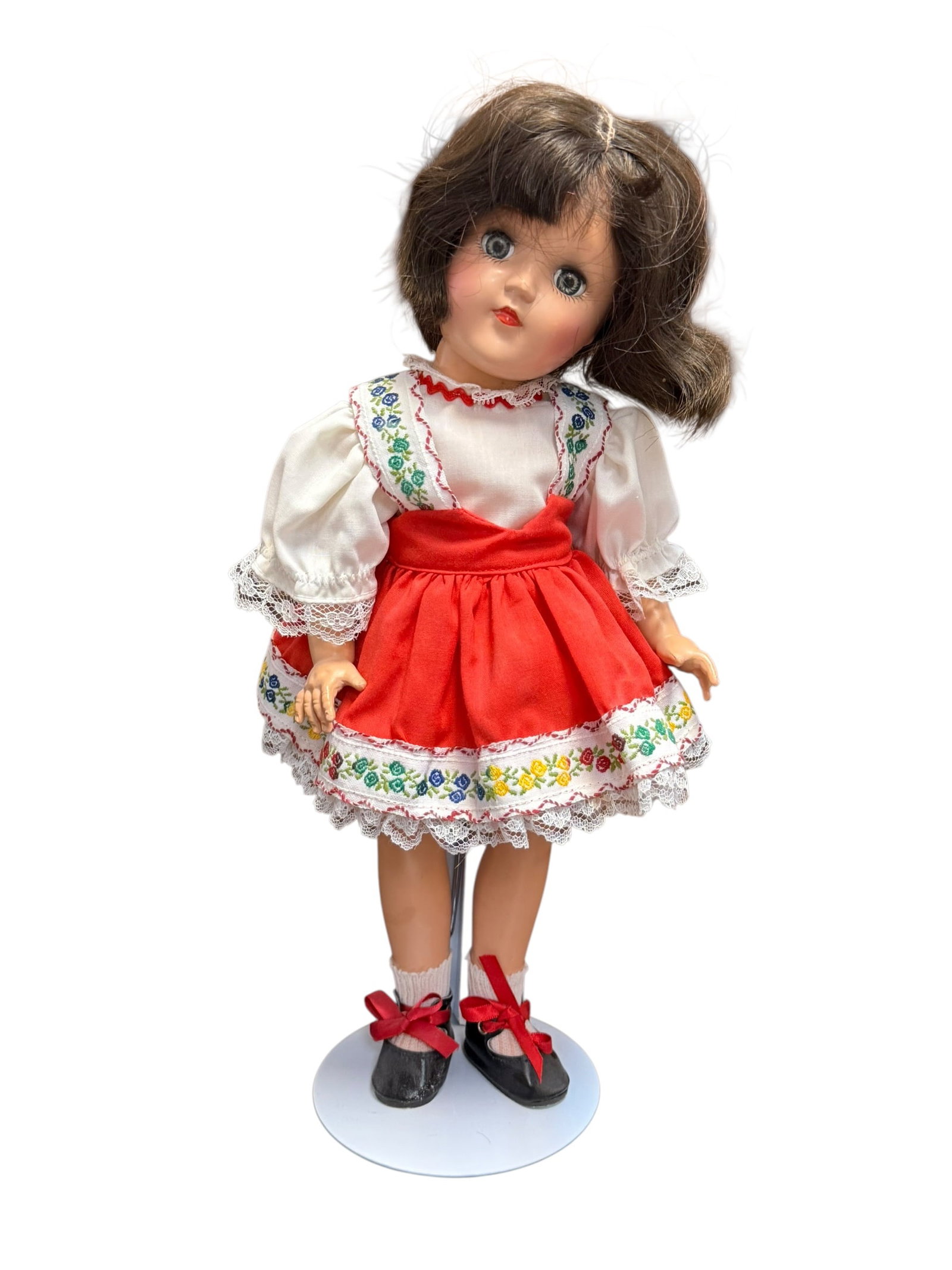 Ideal Playpal Vinyl Doll: This image features a vintage 1950s Ideal Toni doll, a highly collectible hard plastic jointed doll. [1]Key CharacteristicsDoll Model: This appears to be a 14-inch P-90 version of the classic Ideal