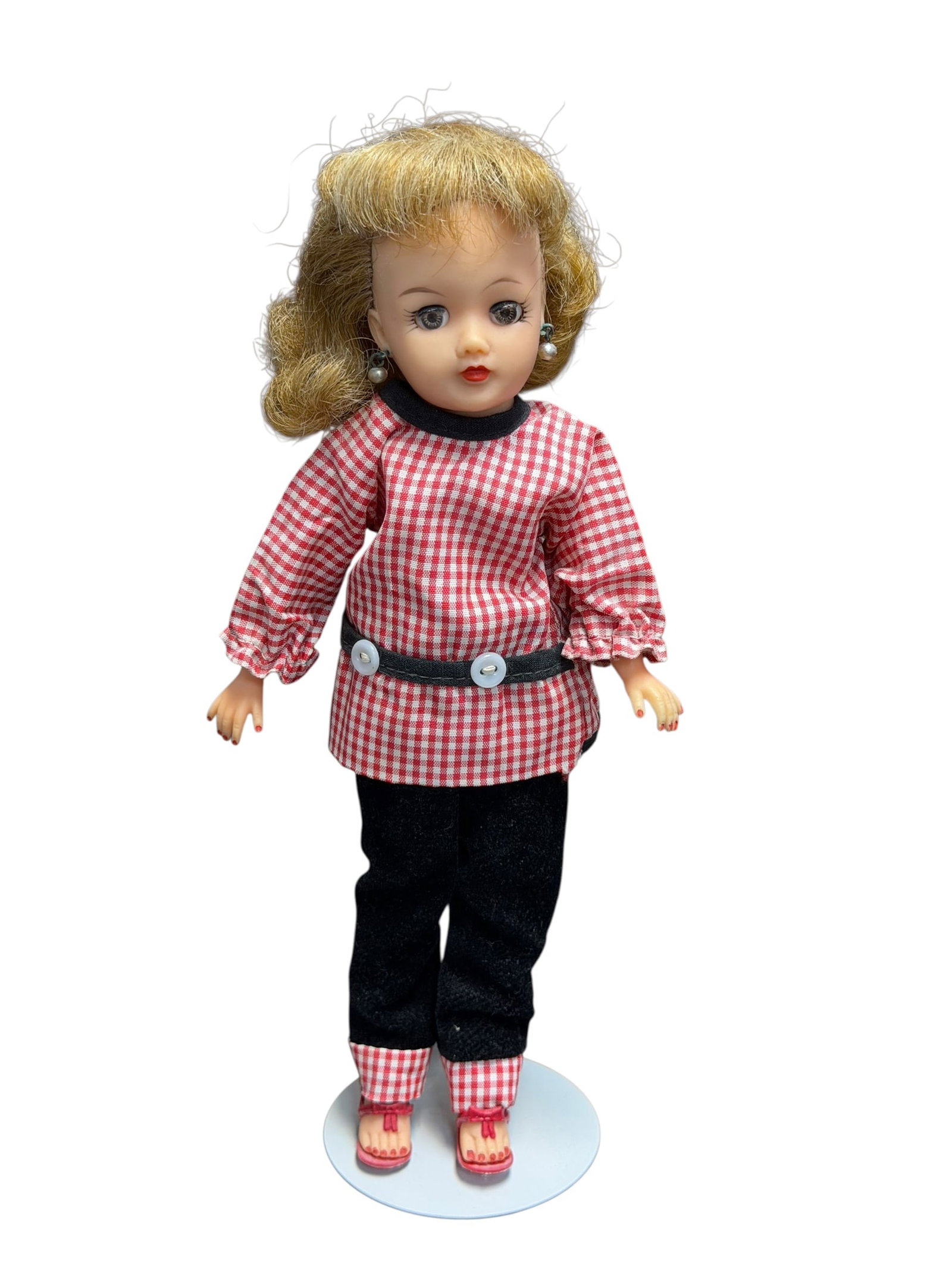 Ideal Vinyl Doll With Stand: vintage 1950s Horsman "Petite Cindy" doll dressed in her original "Sport Set" ensemble. [1]Doll Details & FeaturesBrand & Model: Produced by the Horsman Dolls company starting in the late