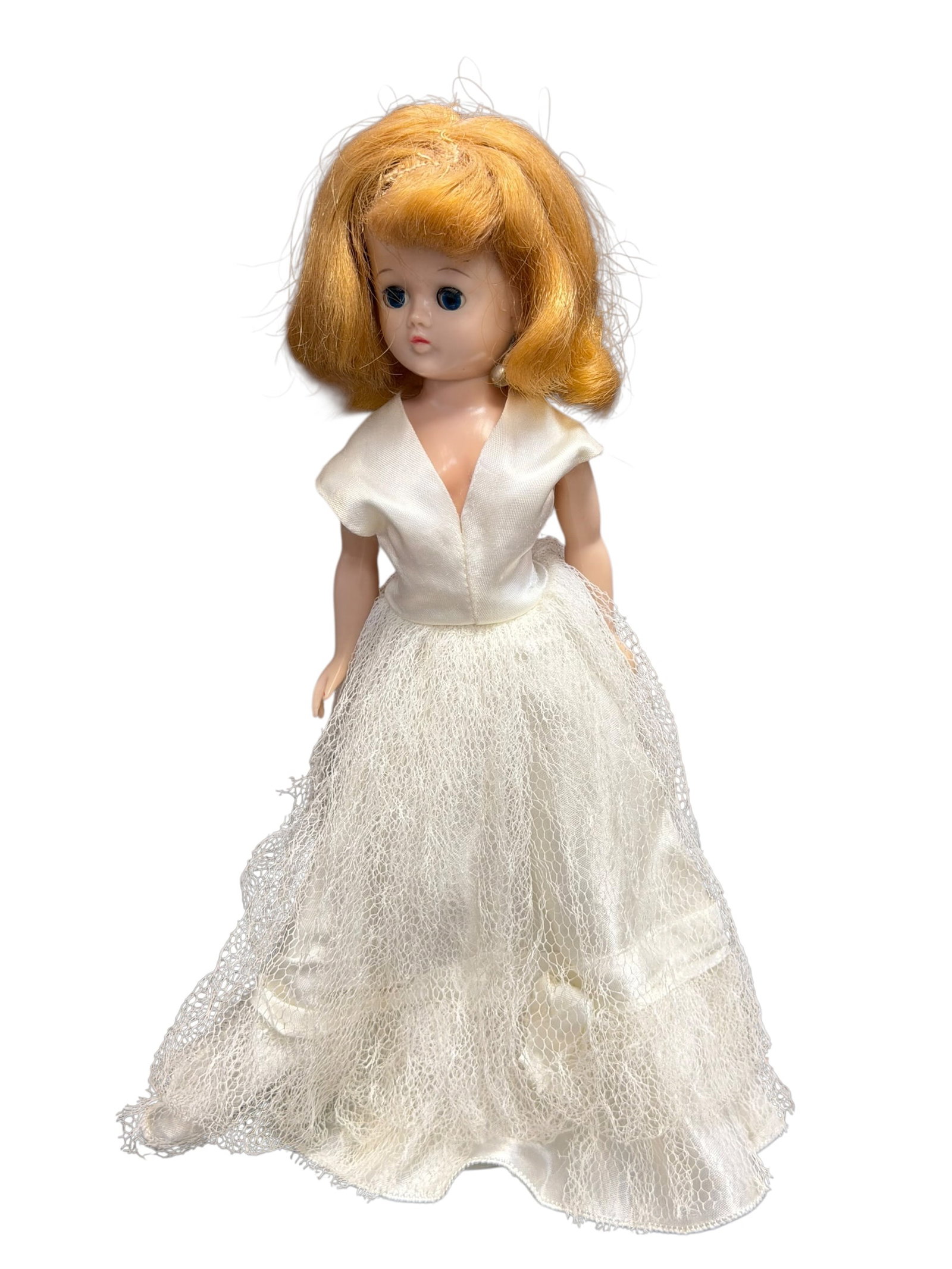 Vogue Vinyl “Jill?? 1957 Plastic doll: vintage 1957 Vogue Jill doll dressed as a bride. Introduced as the "big sister" fashion companion to the famous Ginny doll line, Vogue Jill stands approximately 10 inches tall and is characterized by 