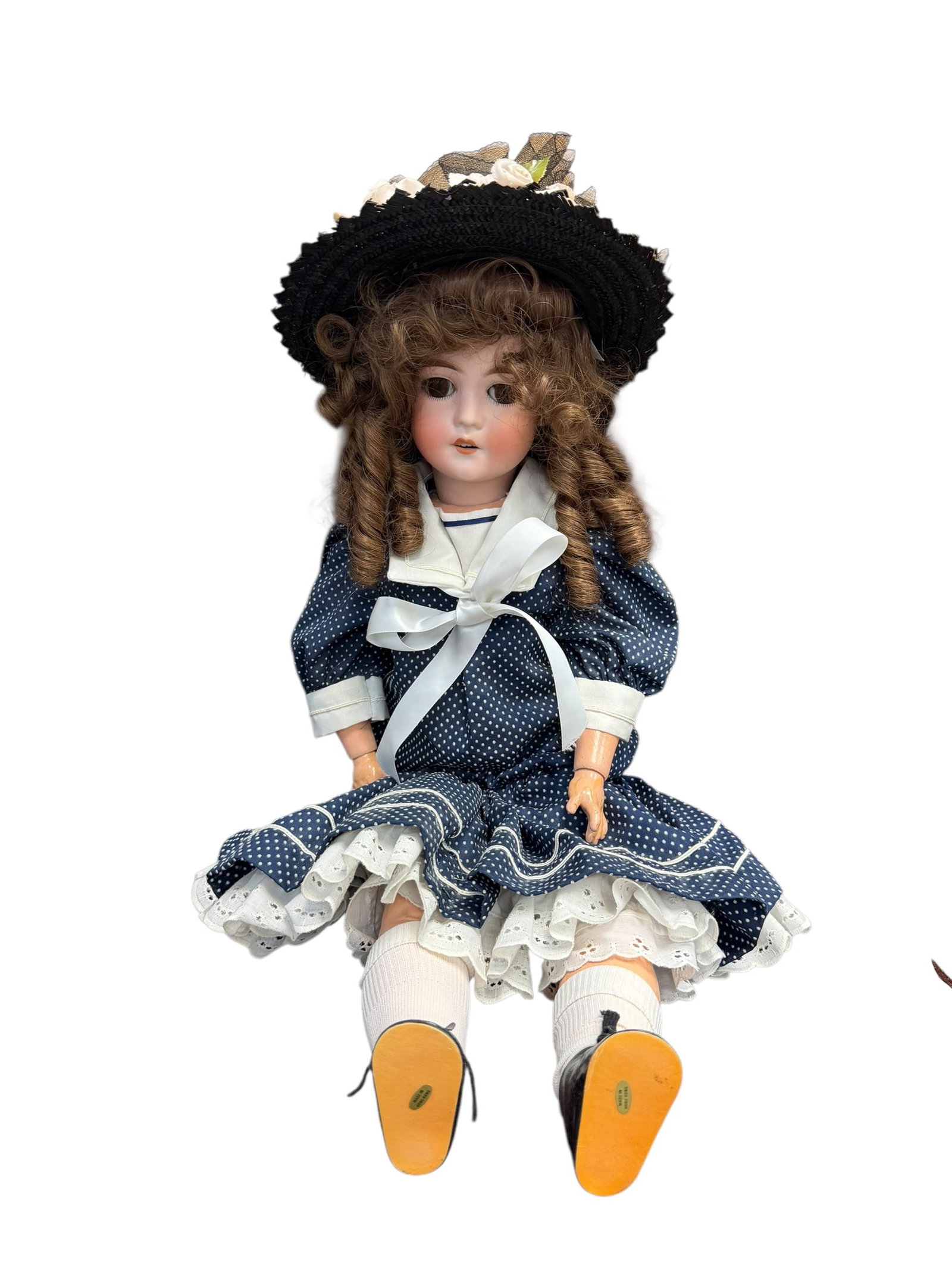 German Bisque Head Doll With Blue Dress: antique German bisque socket-head doll dressed in an elegant, vintage Victorian sailor-style outfit.Based on her facial sculpting, multi-stroke painted eyebrows, glass eyes, open mouth with teeth,