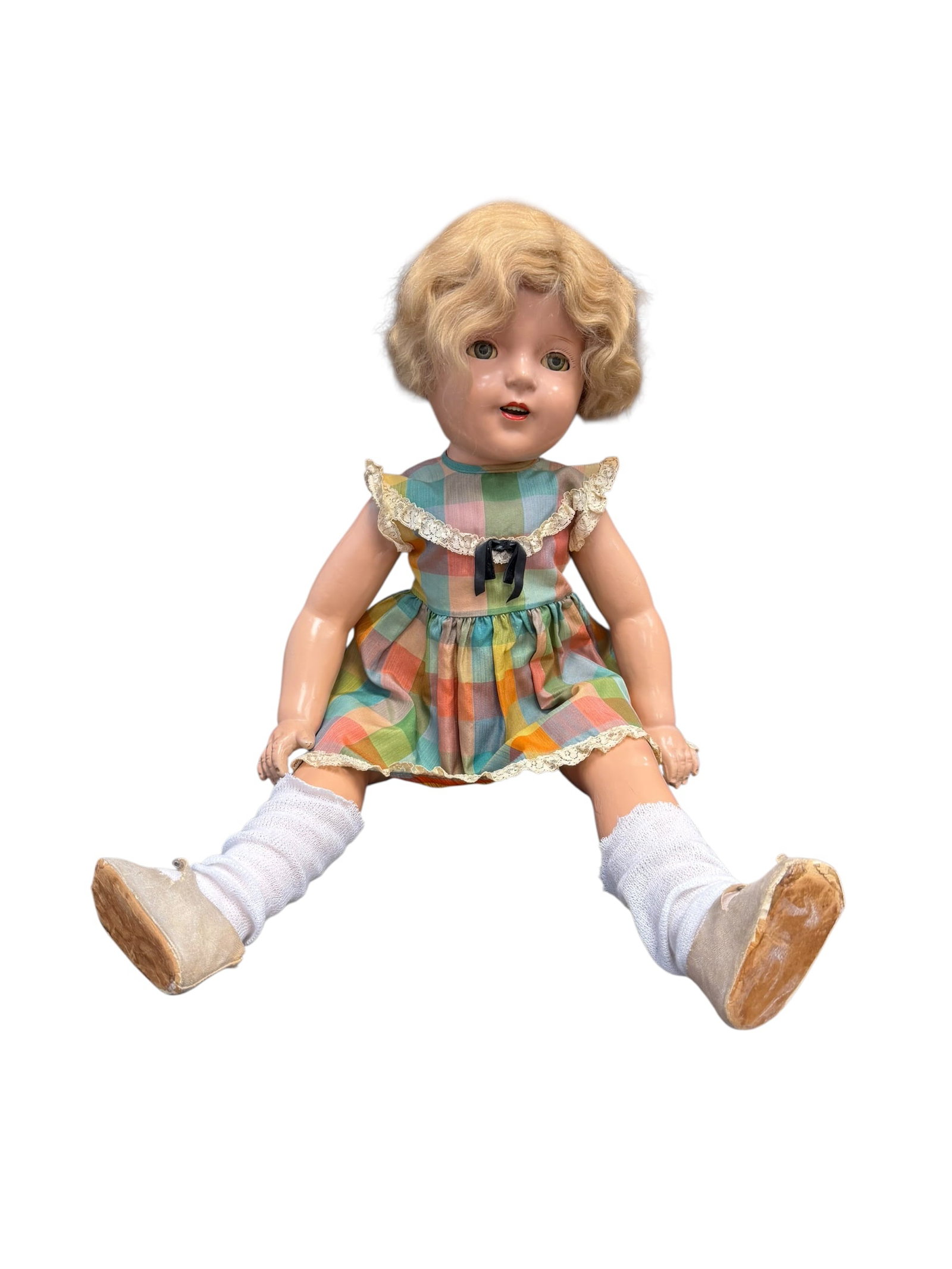 Vintage Composition Doll: Shirley Temple composition doll, a highly collectible toy line originally manufactured by the Ideal Novelty and Toy Company starting in 1934. [1]Key Characteristics & IdentificationMaterial: The doll