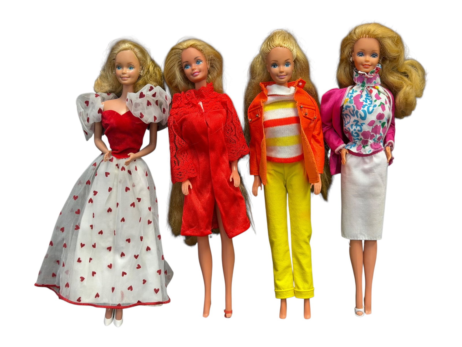 Lot of 4 Barbie Dolls: set of four vintage 1980s Mattel Barbie dolls wearing classic retro outfits. [1]Left (First): Appears to be the 1984 Loving You Barbie wearing her signature white gown with red hearts and puffed sheer